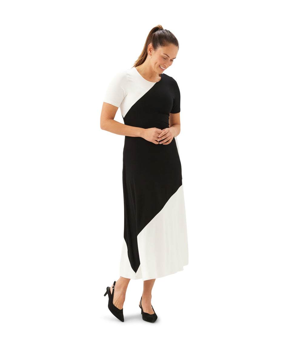 Woman wearing a black and white dress on a white background