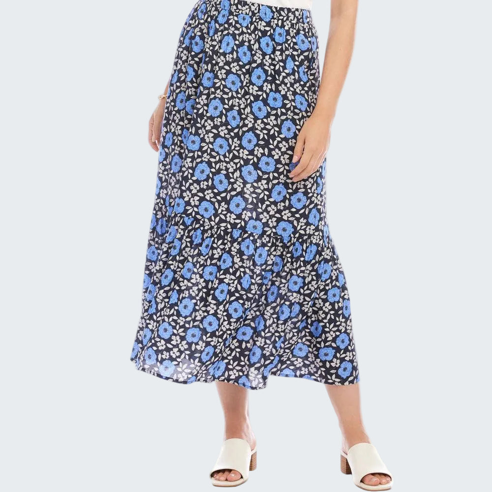 Woman wearing a blue floral skirt on a white background