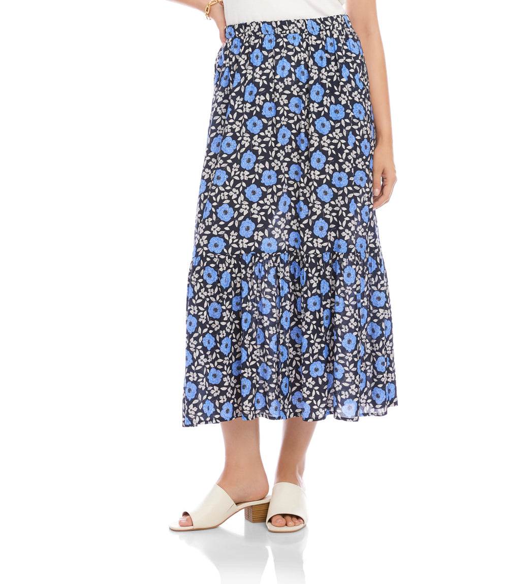 Woman wearing a blue floral skirt on a white background