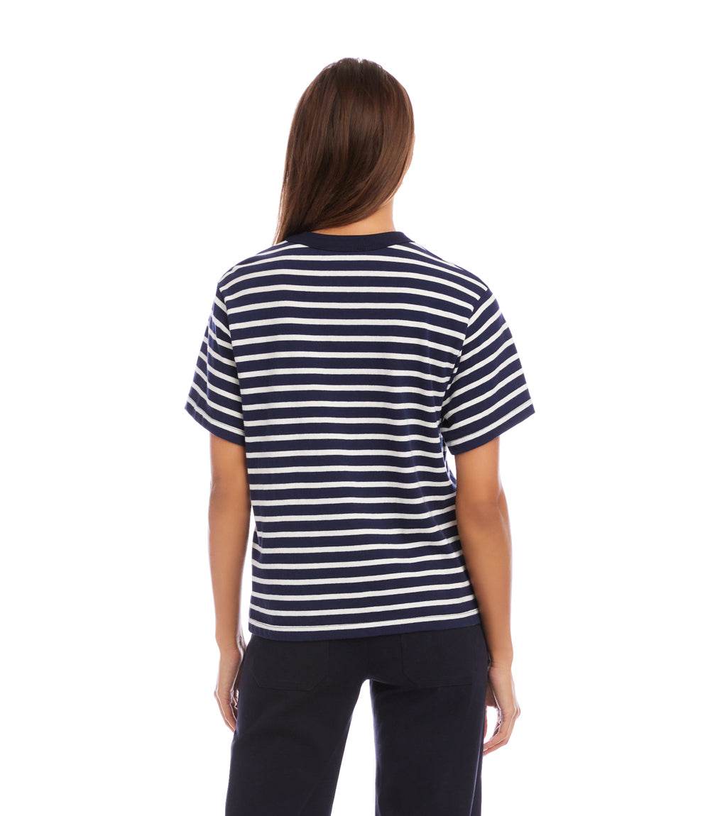 Person wearing a navy and white striped t-shirt on a white background