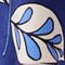Decorative blue leaf design on a white background