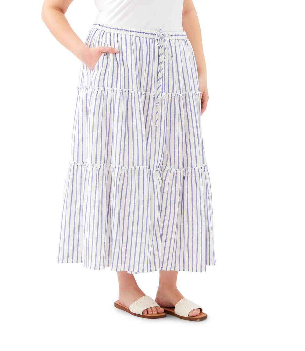 Woman wearing a tiered striped skirt on a white background