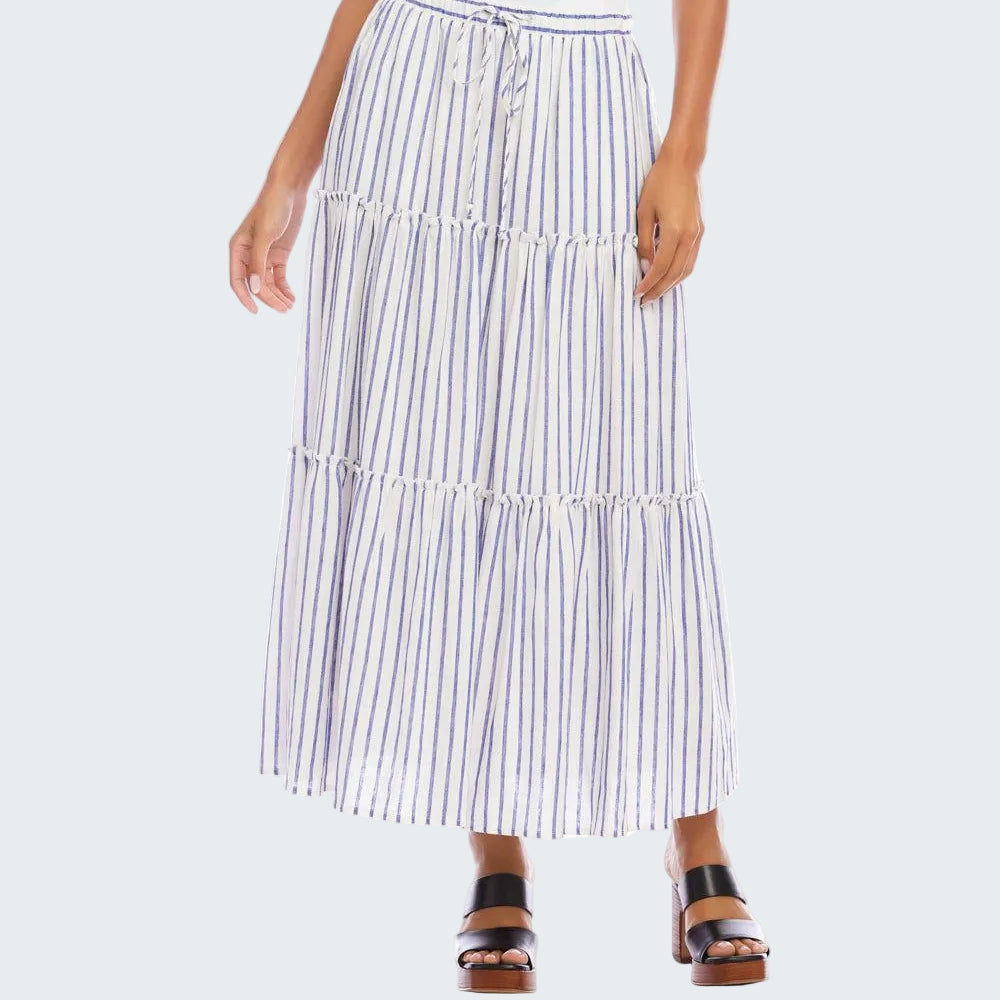 Woman wearing a long striped skirt on a white background