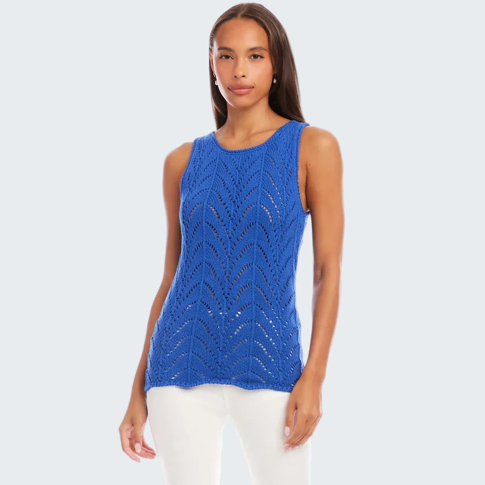 Woman wearing a blue sleeveless top with a white background