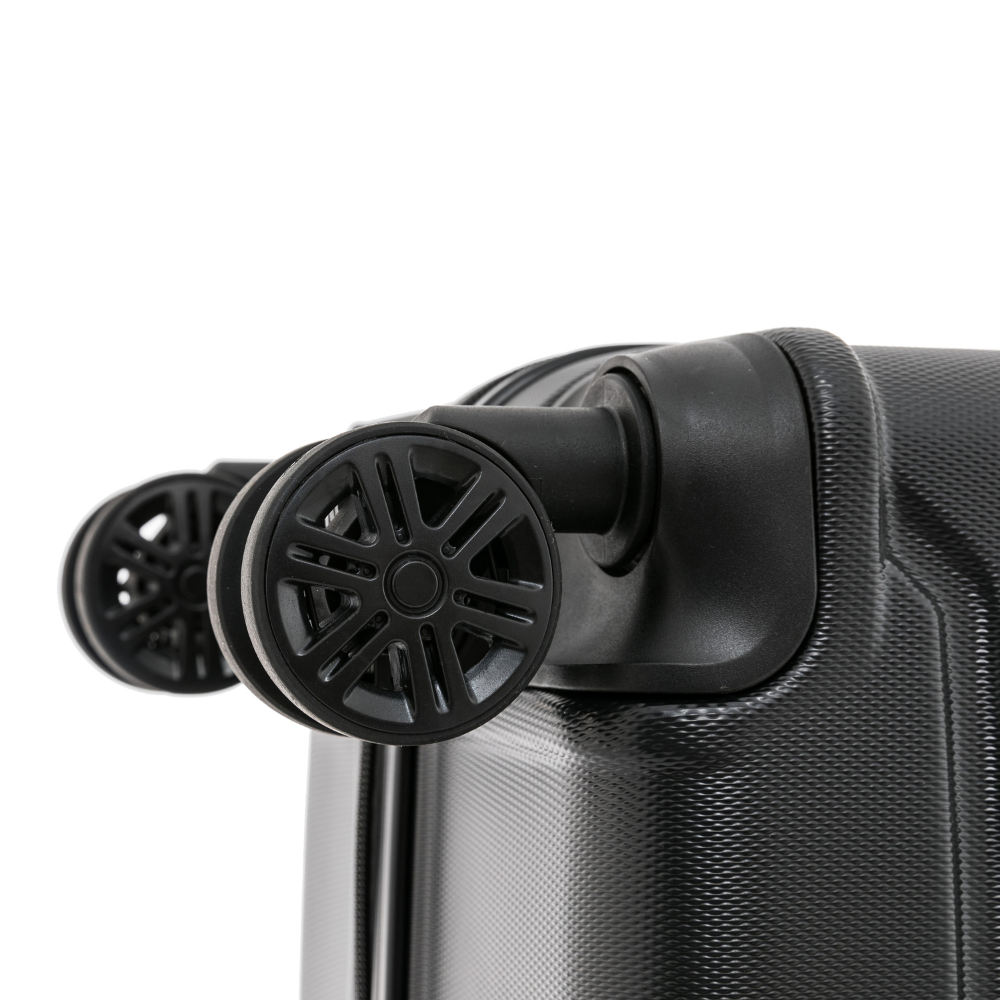 Close-up of a black suitcase with wheels on a white background