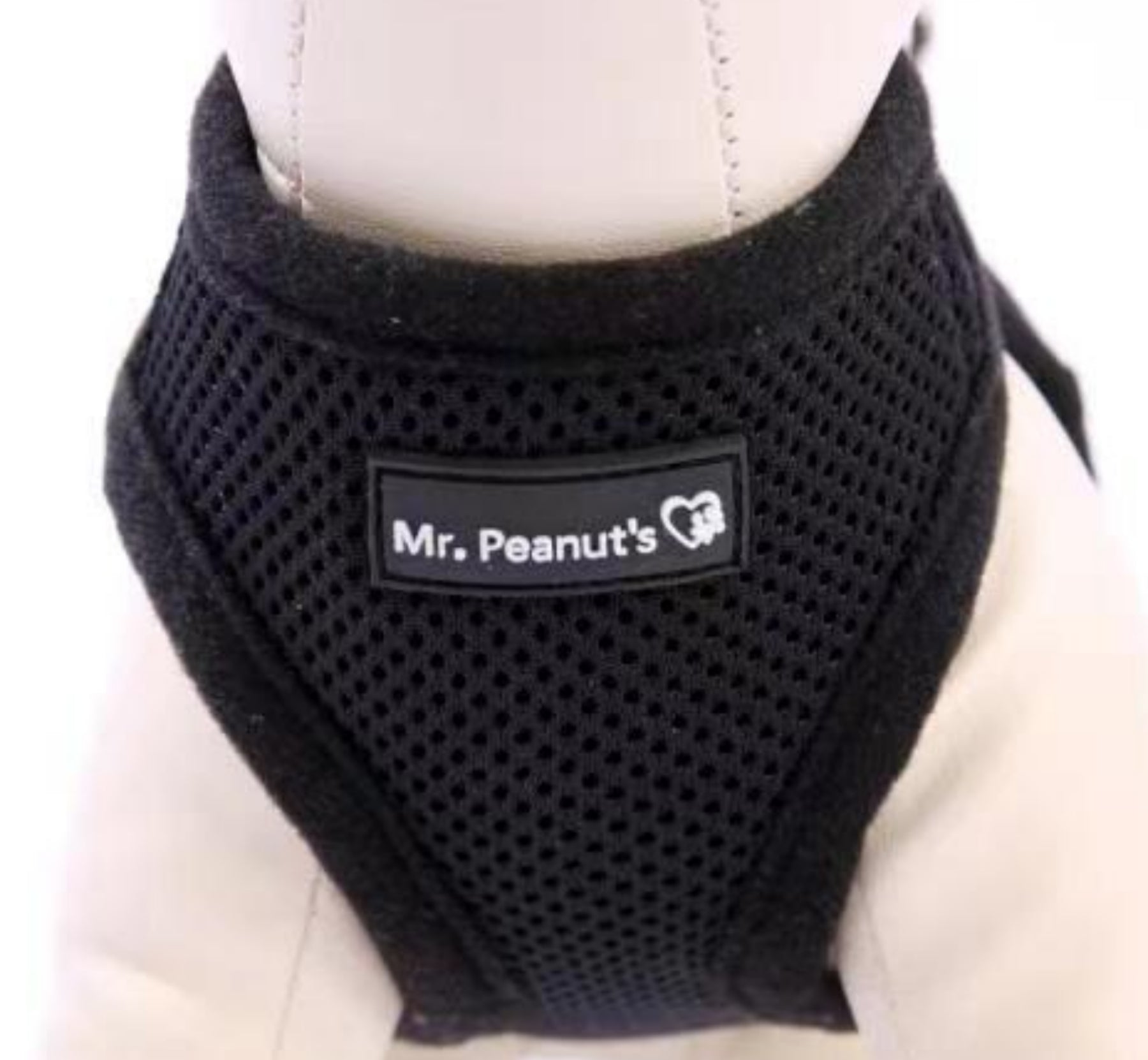 Black mesh dog harness with 'Mr. Peanut's' logo on a white background