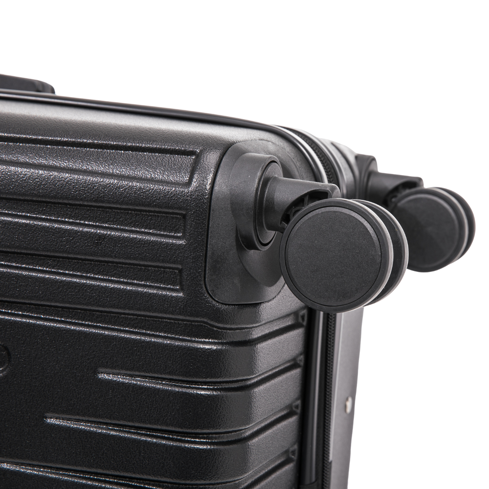 Close-up of a black suitcase handle on a white background