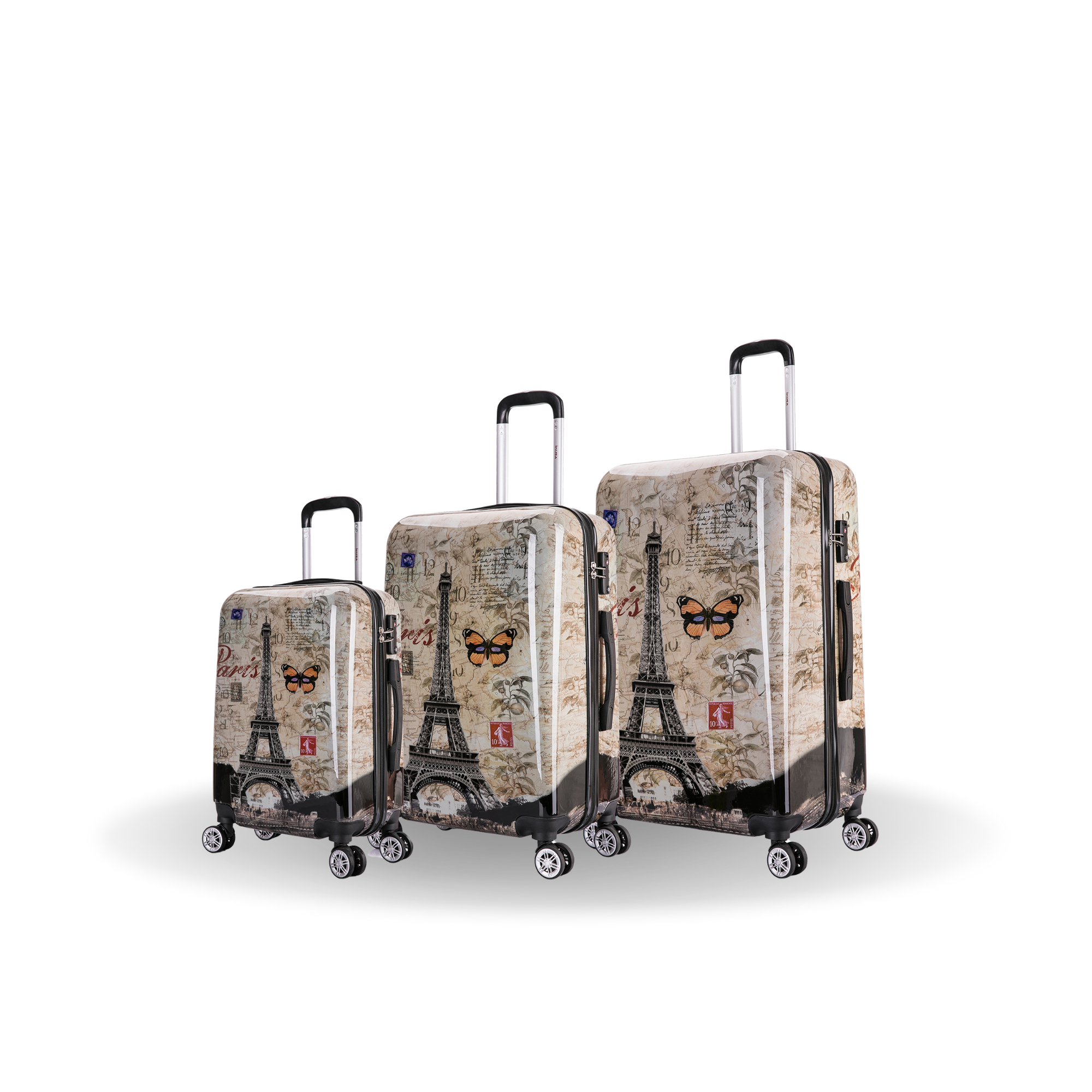 Three suitcases with Eiffel Tower design on a white background