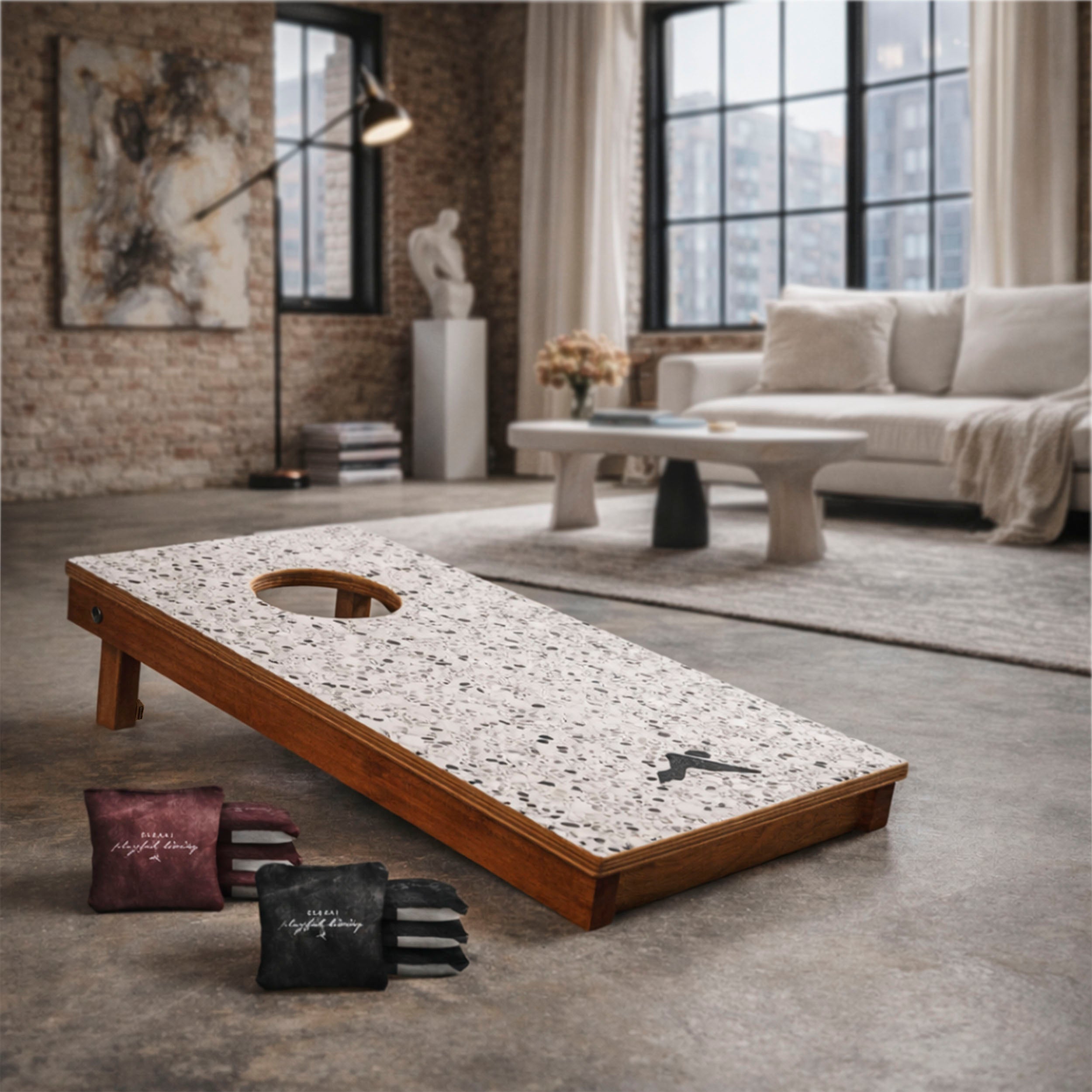 Cornhole board with bags on a concrete floor in a modern living room.