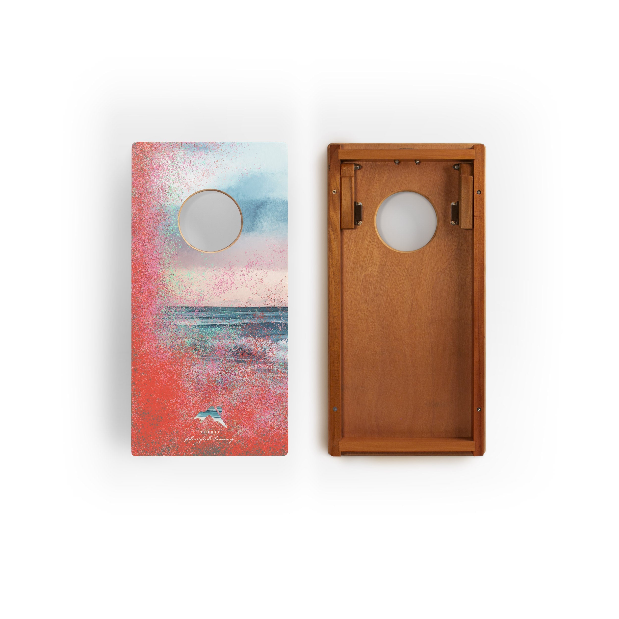 Two cornhole boards with artistic designs on a white background