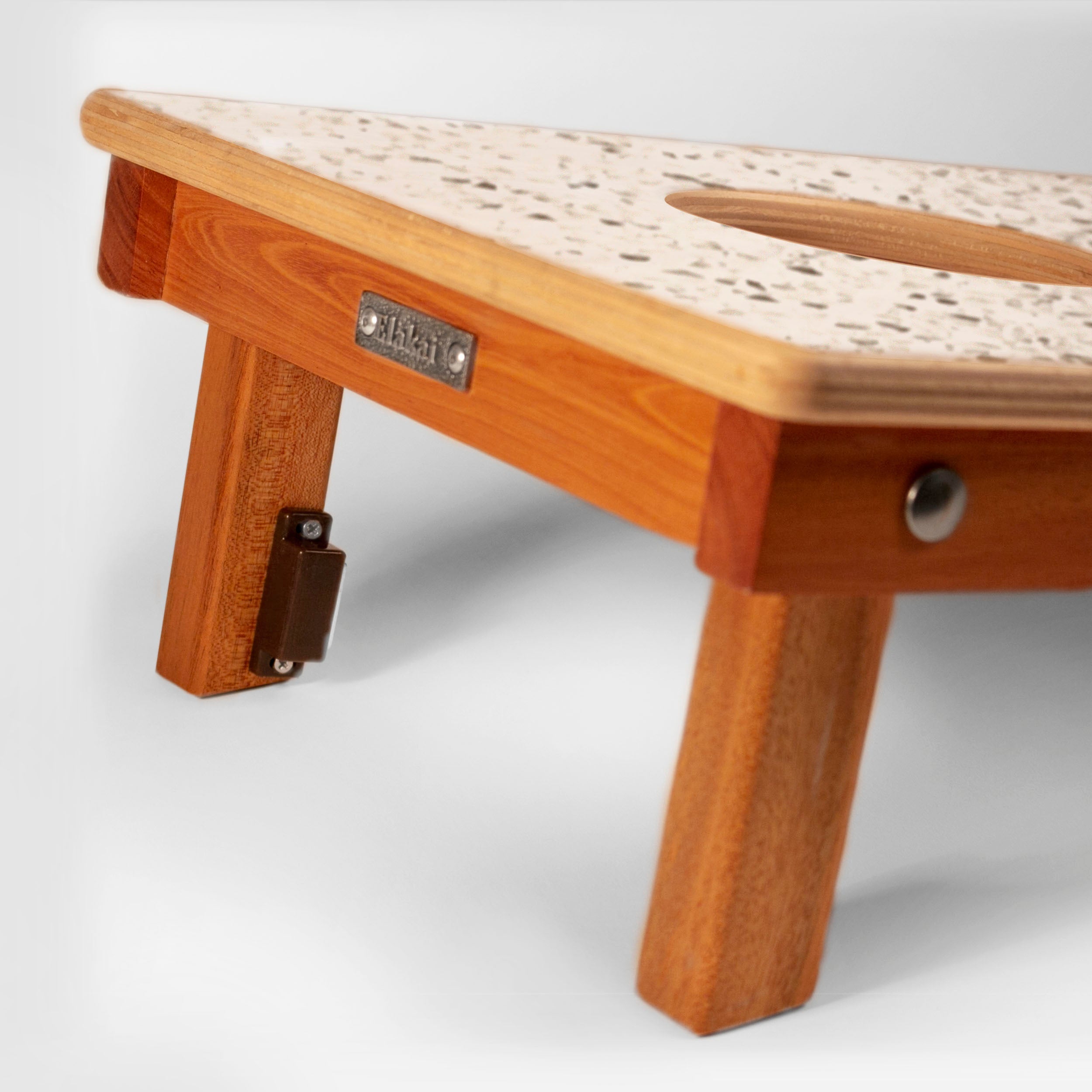 Wooden bench with a textured top on a white background