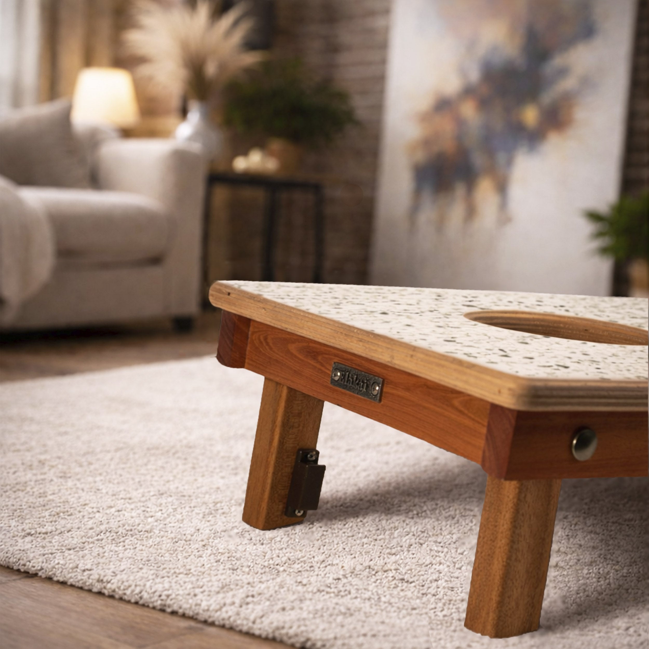 Wooden coffee table in a living room setting with blurred background