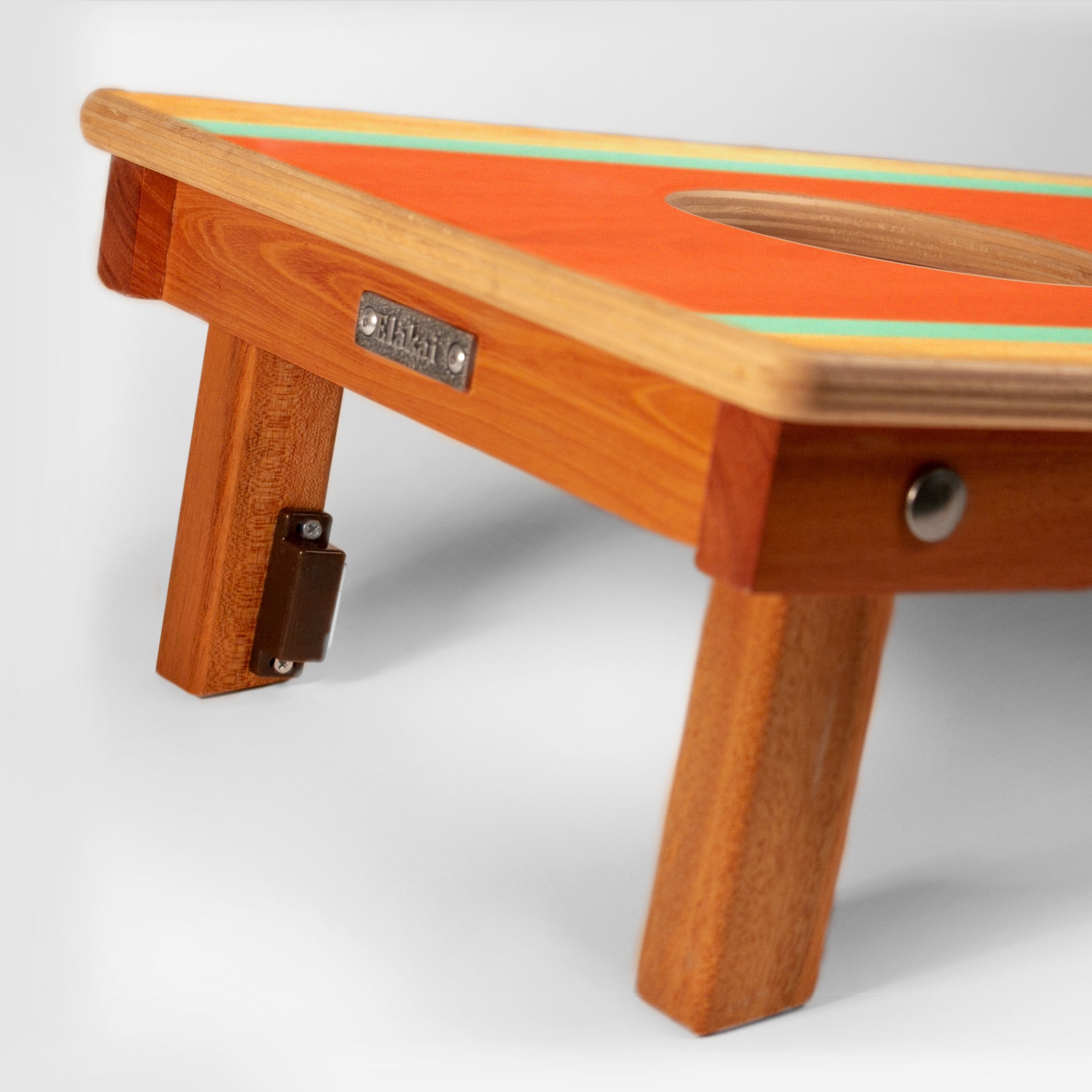 Wooden bench with a colorful top on a white background