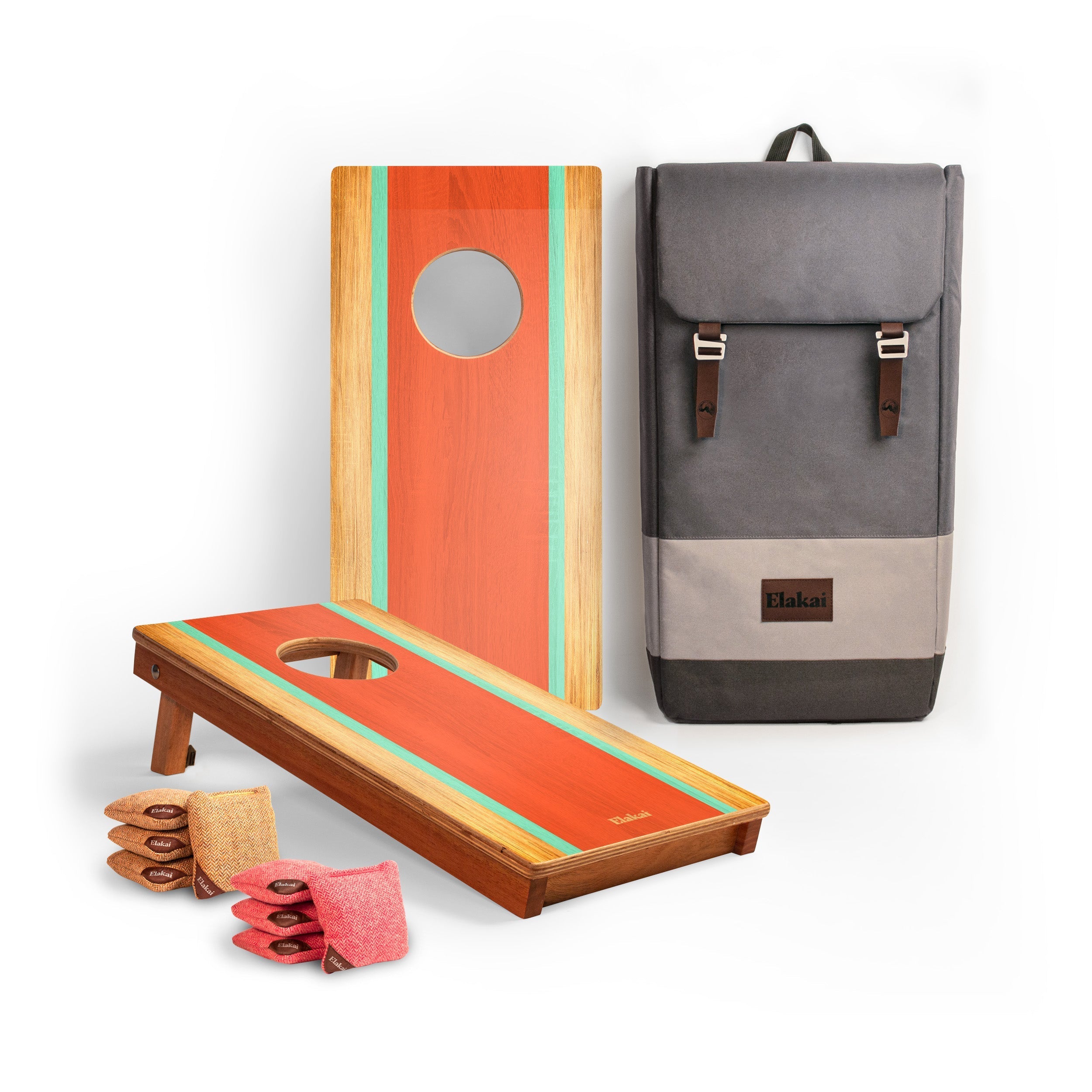 Cornhole boards with bags and a backpack on a white background