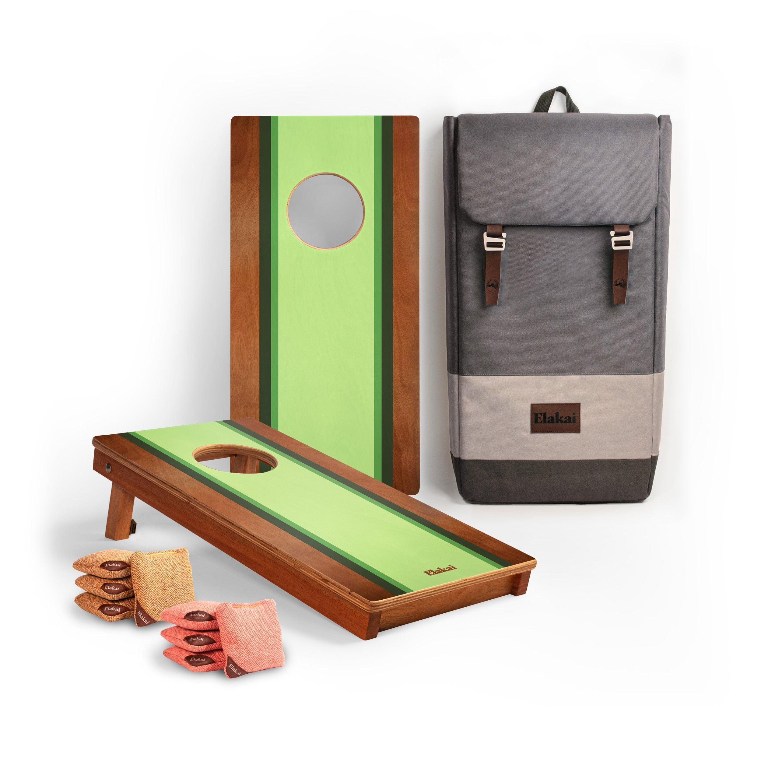 Cornhole boards with green and brown design, a gray backpack, and bags on a white background