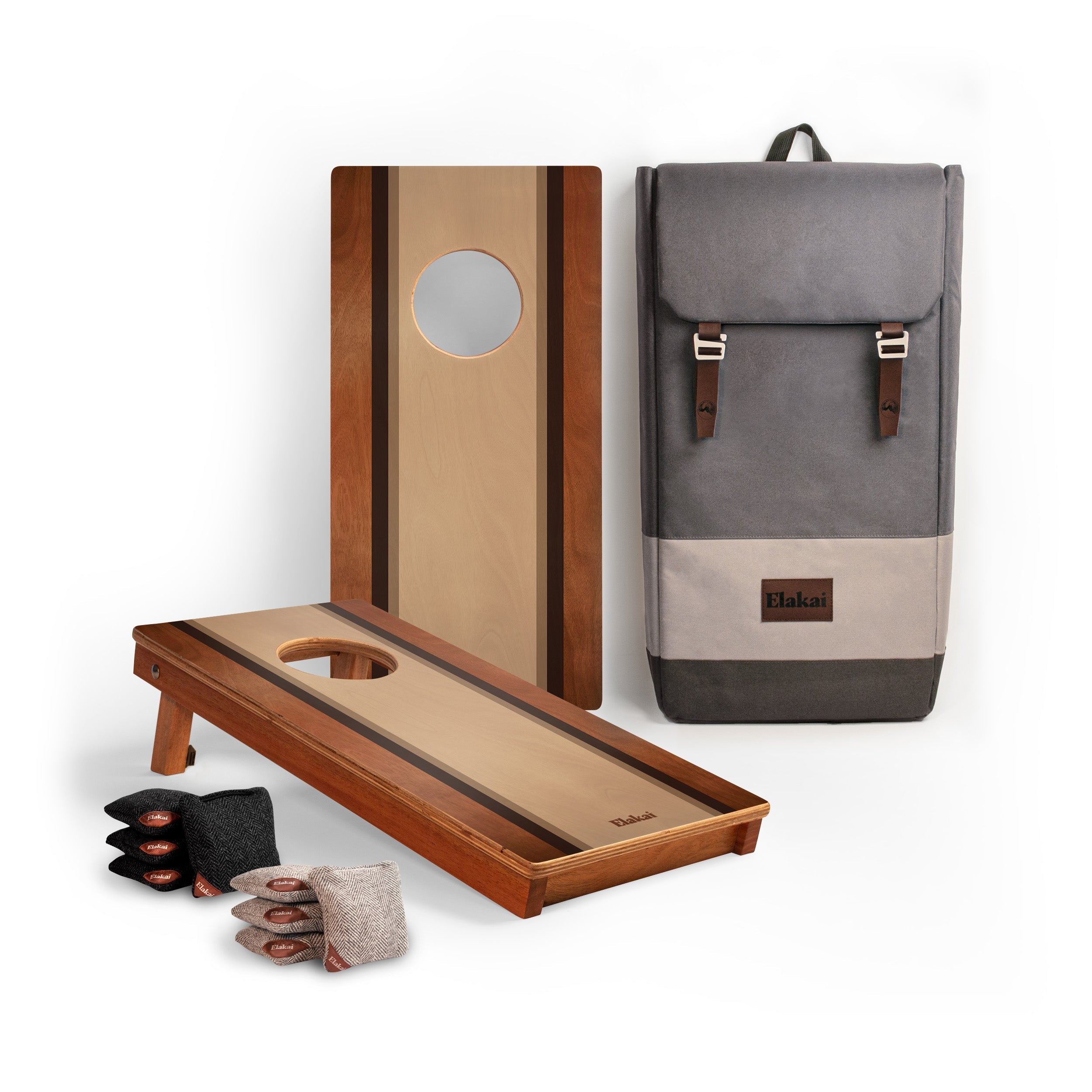 Cornhole boards, bags, and a backpack on a white background