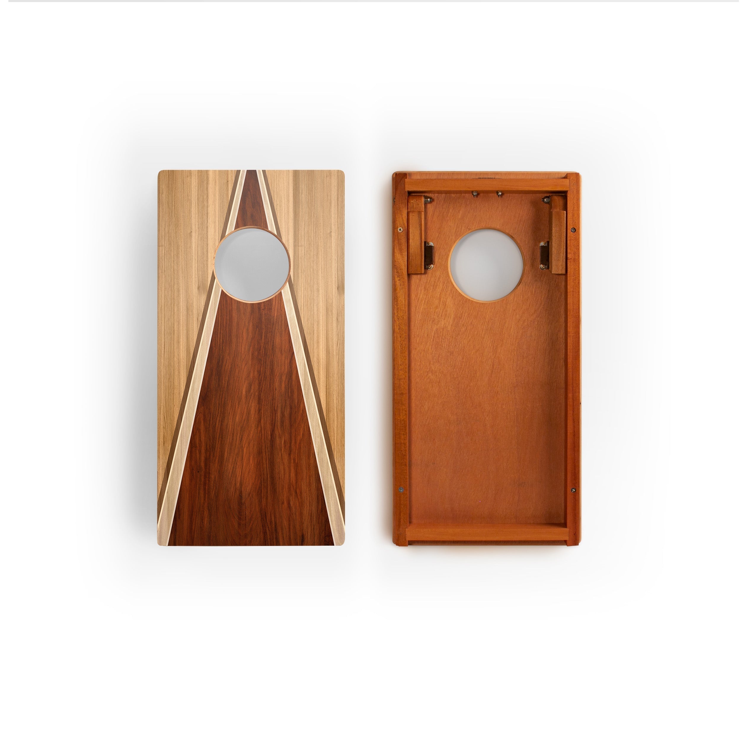 Two wooden cornhole boards shown side by side on a white background, one displaying the top with a geometric inlay design and the other showing the solid wood interior.
