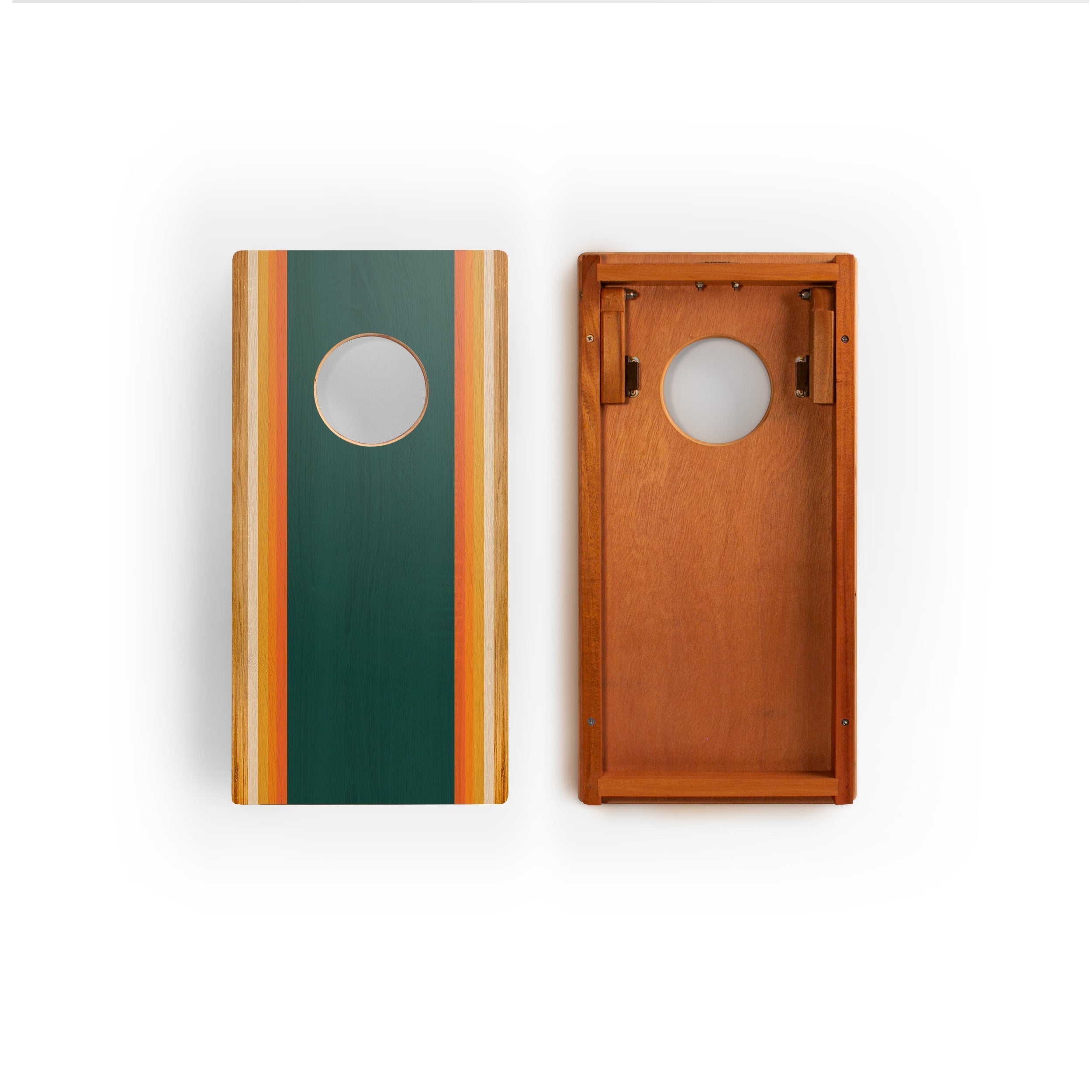 Two wooden cornhole boards shown side by side on a white background, one displaying the green front with orange and beige stripes, and the other showing the warm brown wood grain interior.