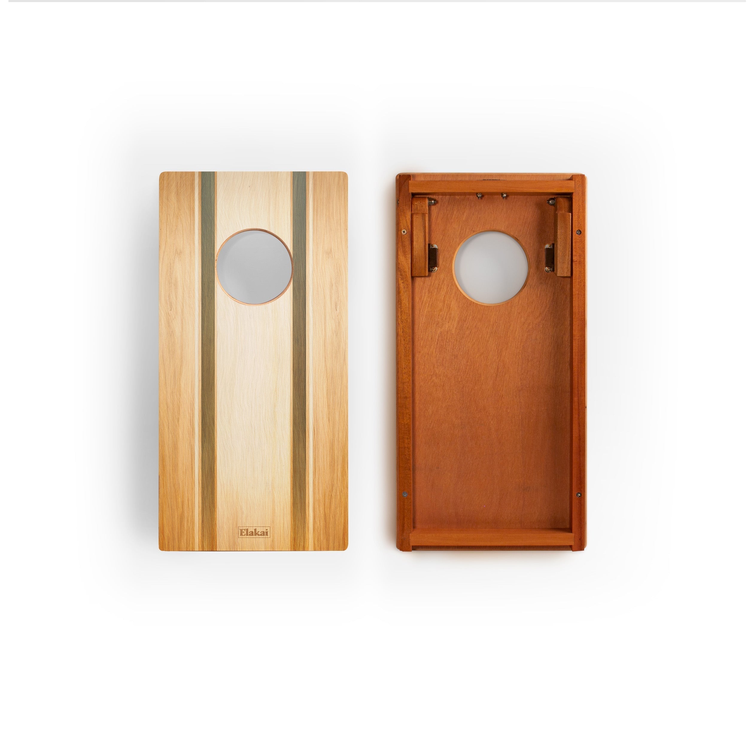 Two wooden cornhole boards shown side by side on a white background, one displaying the light natural wood front with dark vertical inlay stripes and a circular hole, and the other showing the warm medium-brown wood interior with a matching circular cutout.