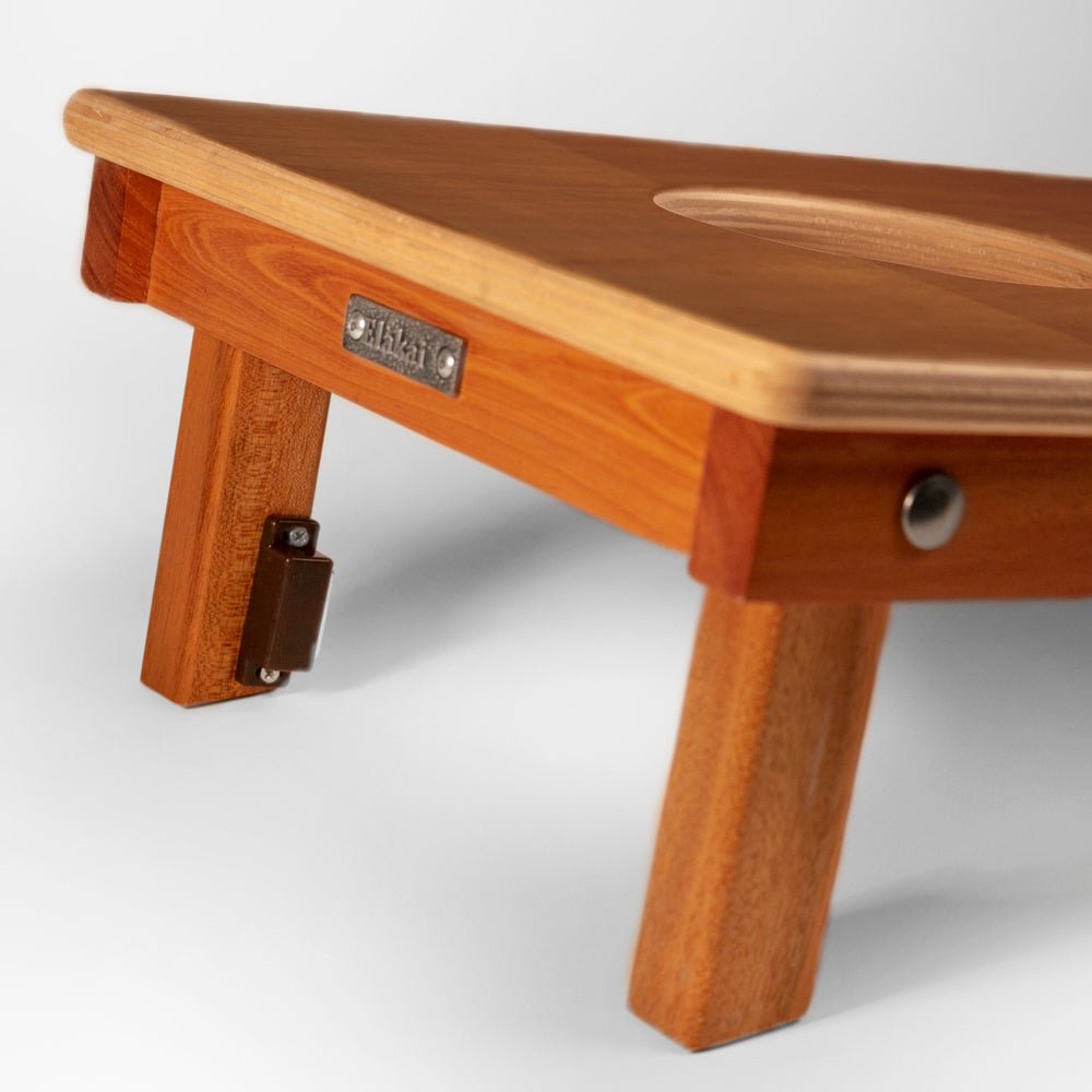 Wooden step stool with a visible brand label on a white background