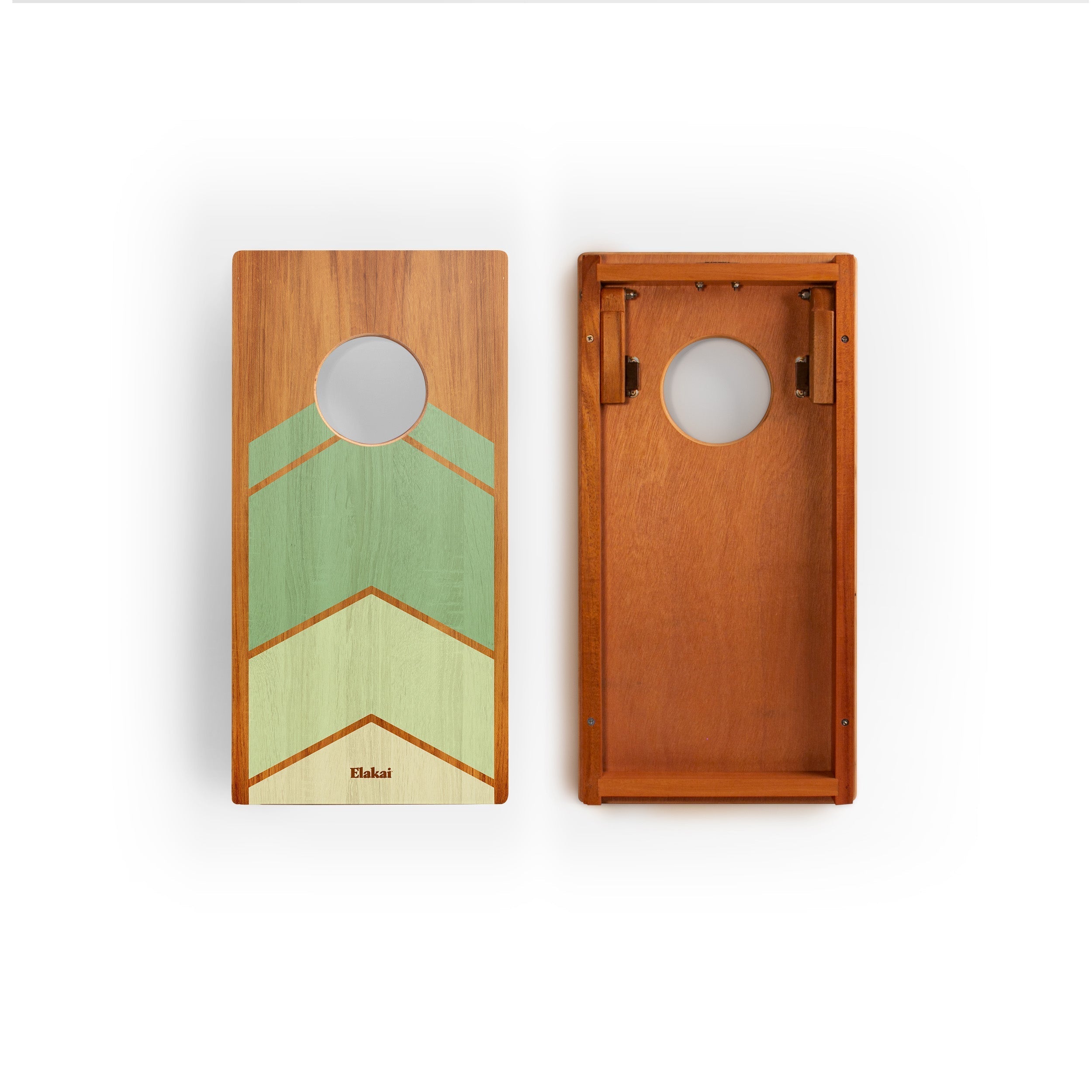 Two wooden cornhole boards with geometric designs on a white background