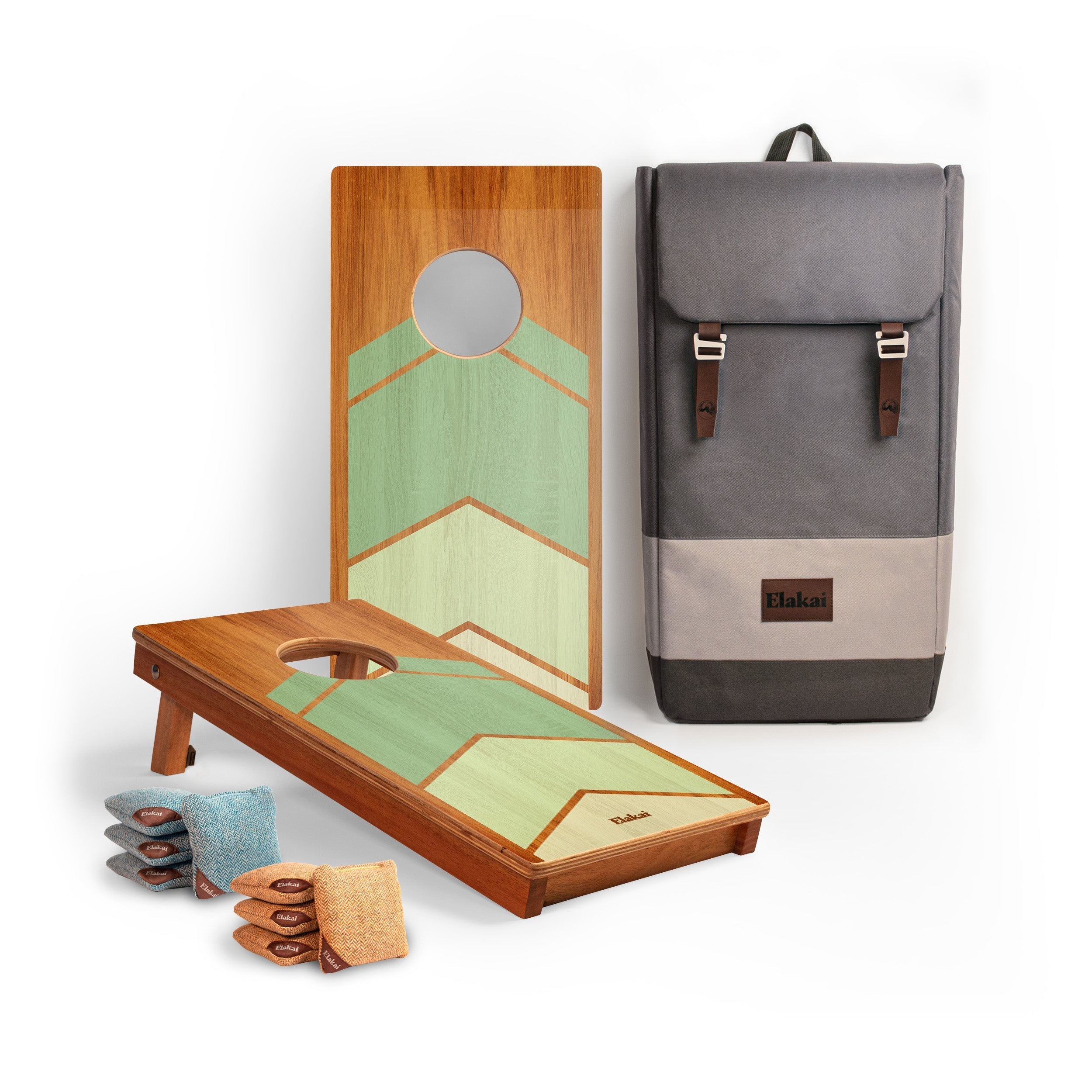 Cornhole board set with bags and a gray backpack on a white background