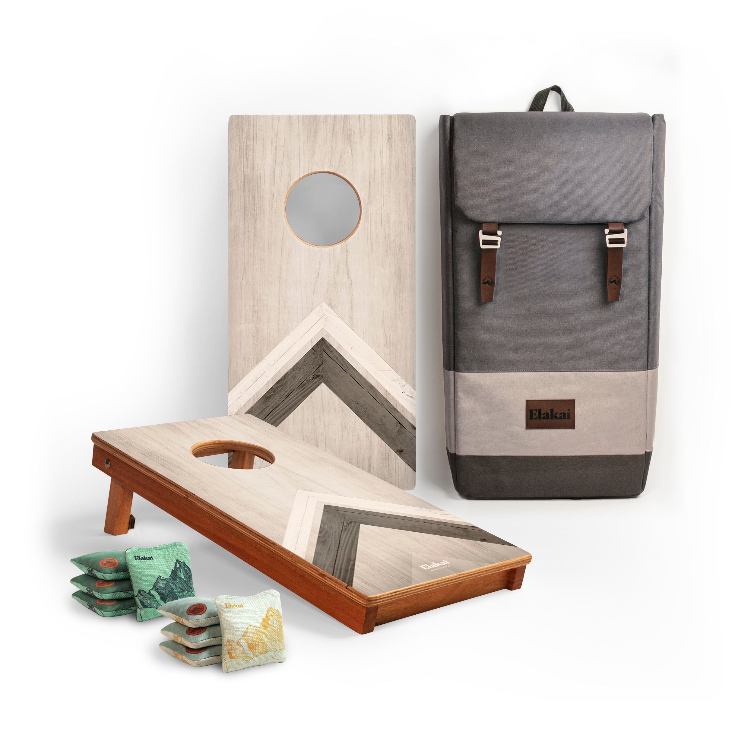 Cornhole boards with bags and a backpack on a white background