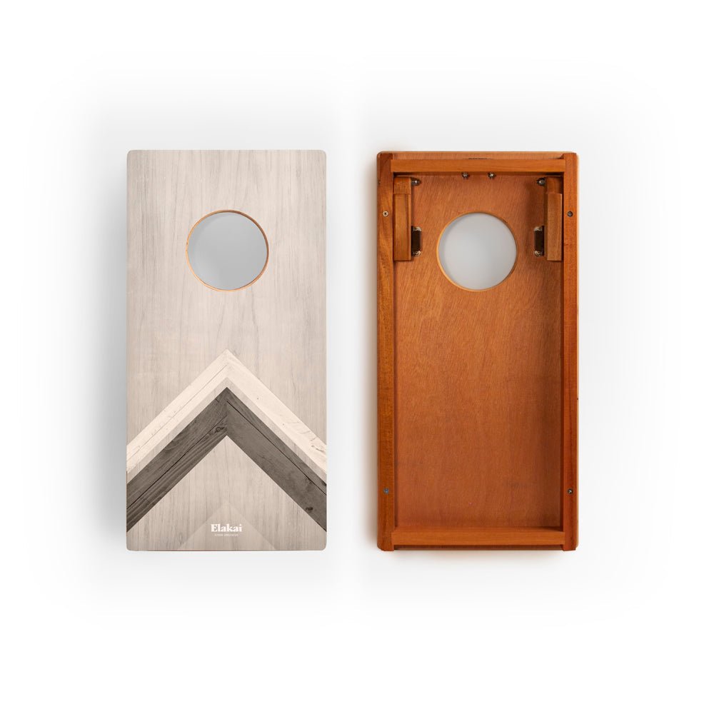 Two wooden boards with a circular cutout and geometric design on a white background