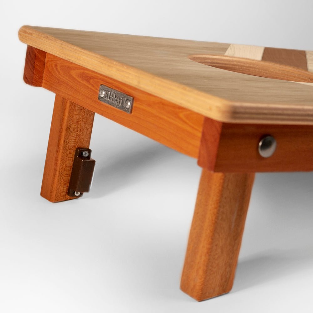 Wooden step stool with a visible brand label on a white background