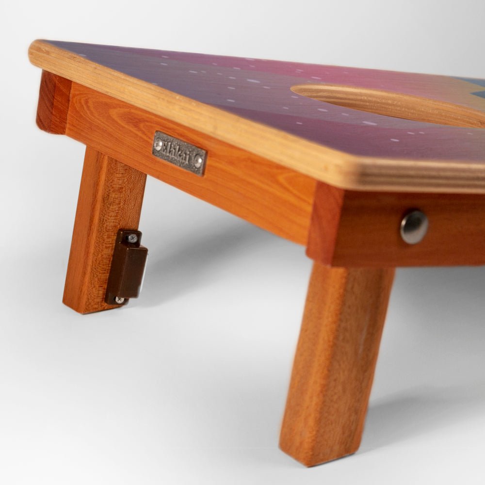 Wooden stool with a colorful seat on a white background