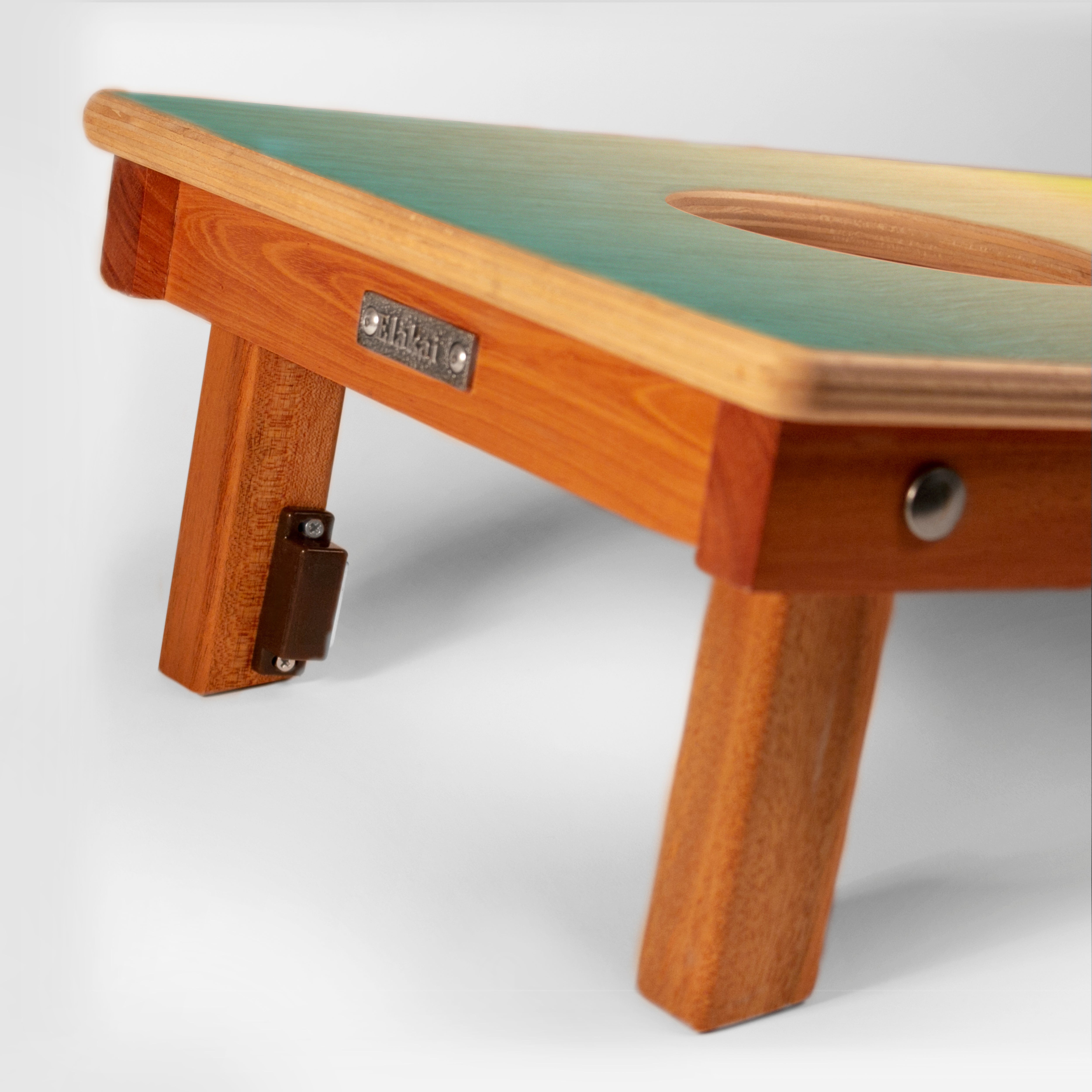 Wooden bench with green seat on a white background