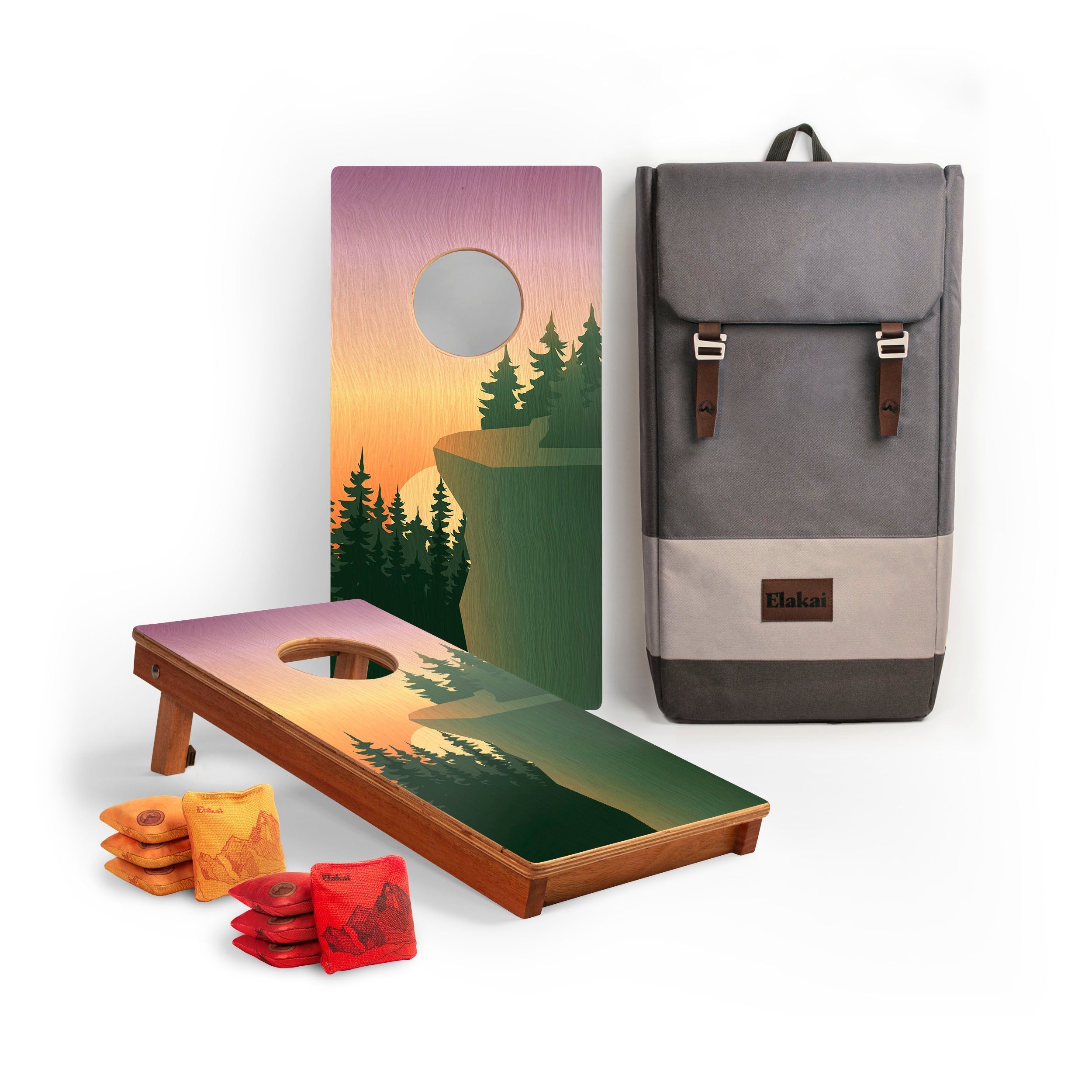 Cornhole boards with nature-themed design, backpack, and bags on a white background