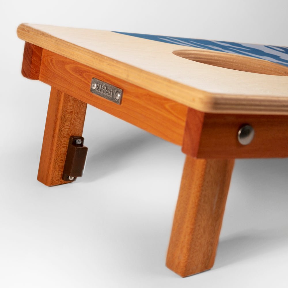 Wooden footstool with a metal bracket on a white background