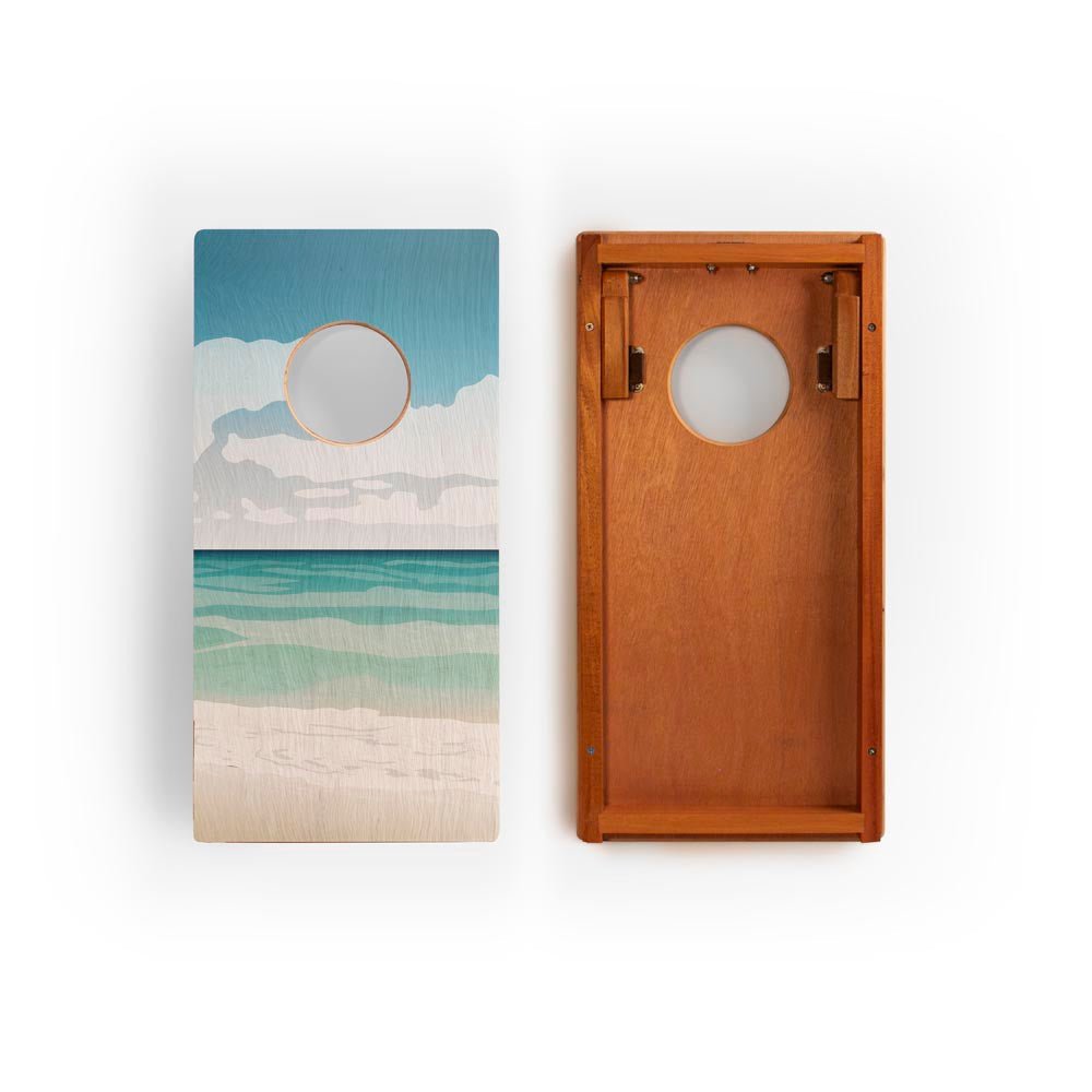 Cornhole board with beach scene design on one side and wooden texture on the other