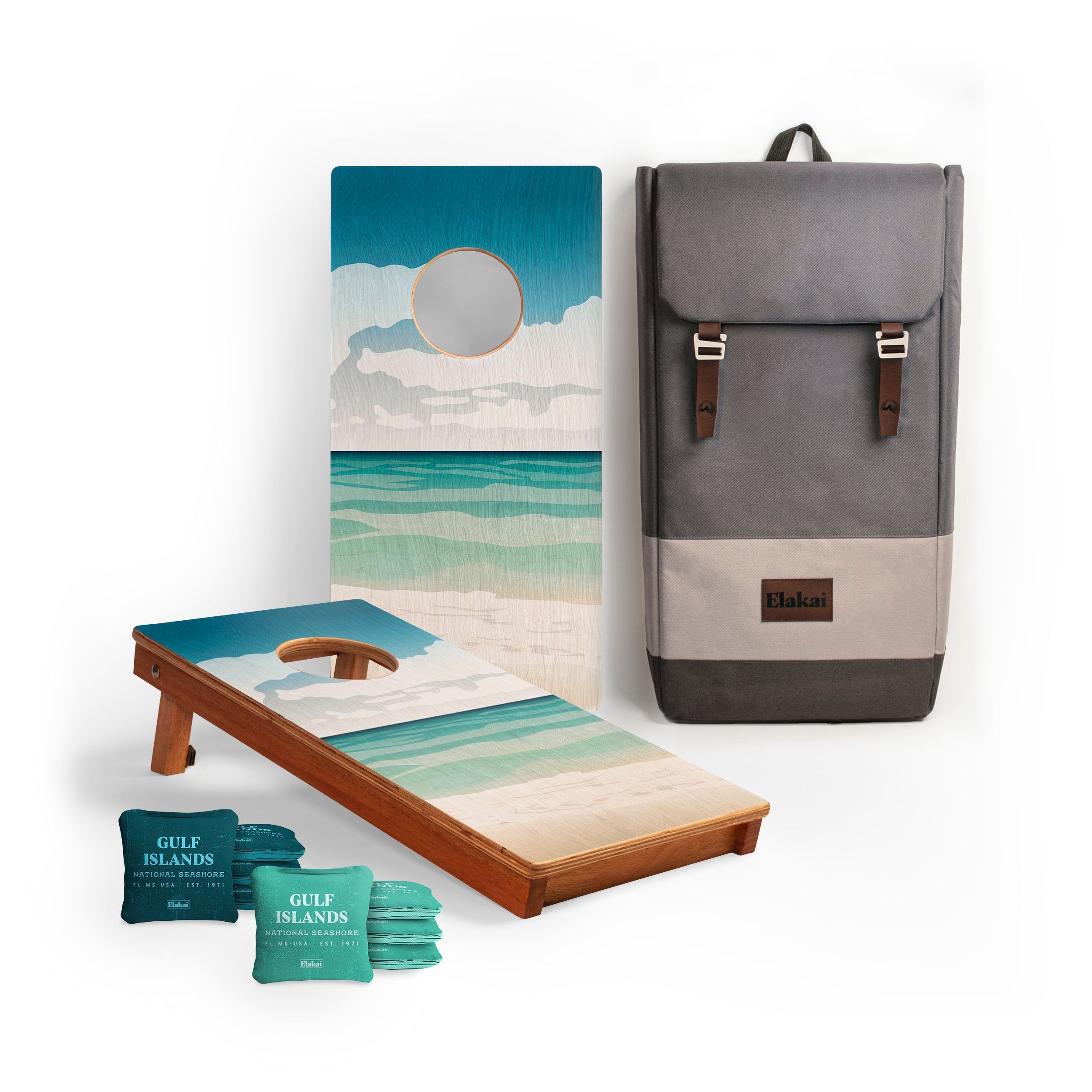 Cornhole set with beach-themed design, backpack, and beach towels on a white background