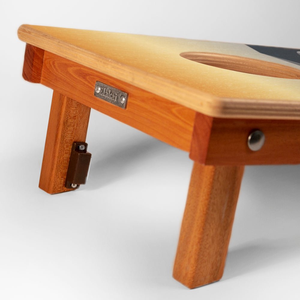 Wooden footstool with a visible brand label on a white background