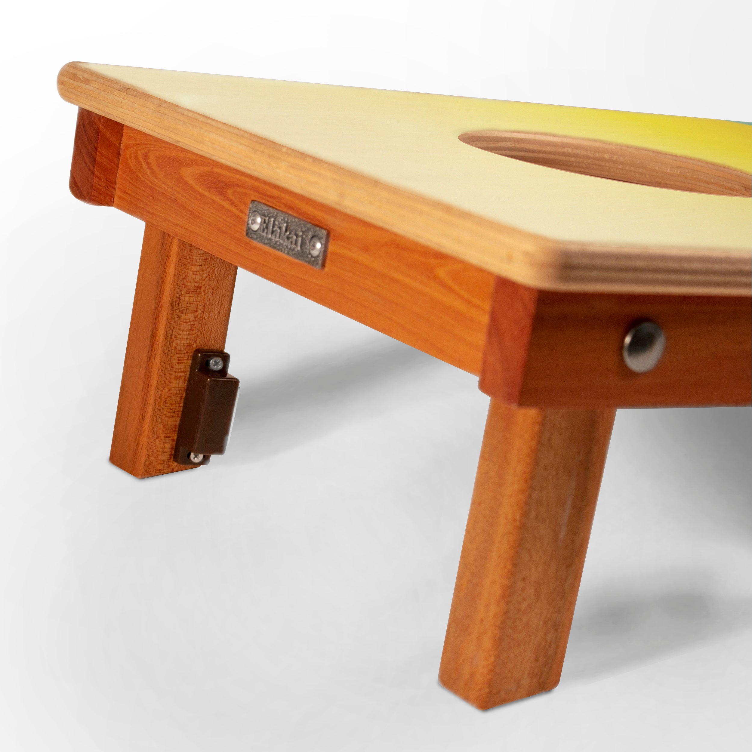 Wooden stool with a visible brand label on a white background
