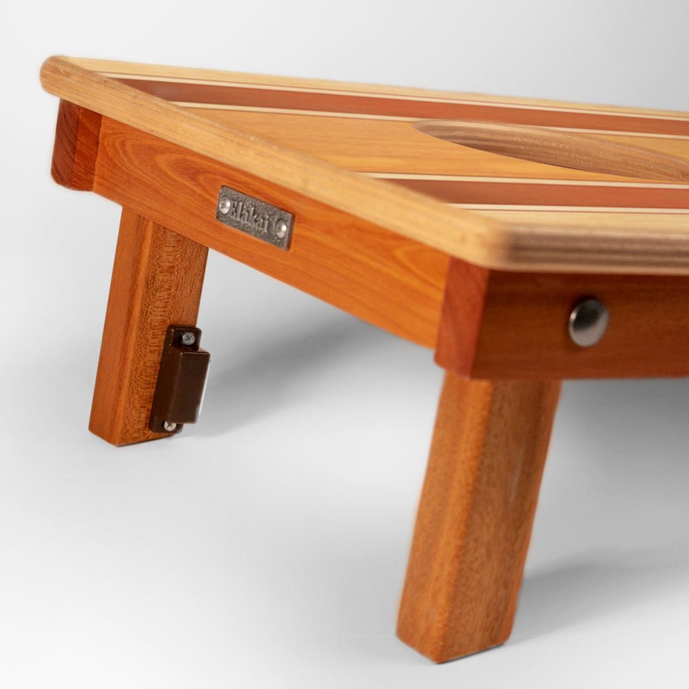 Wooden stool with a metal bracket on a white background