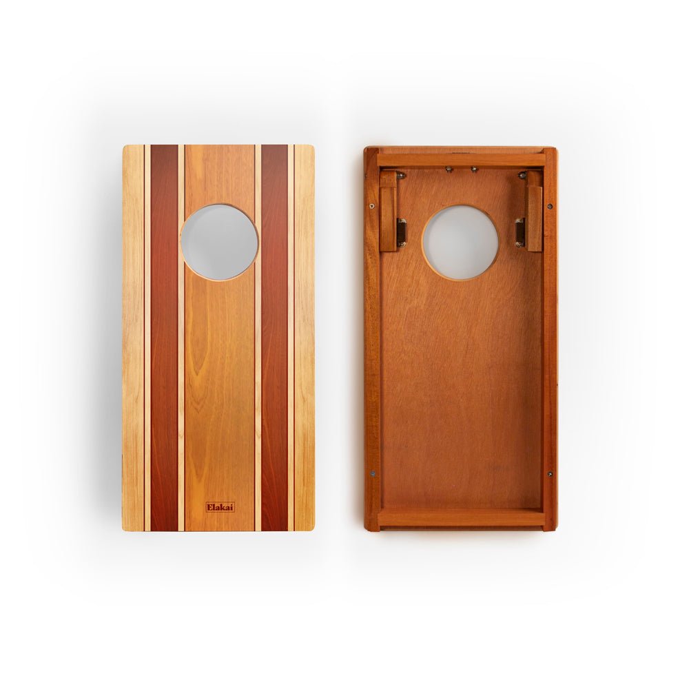 Two wooden cornhole boards with a striped design on a white background