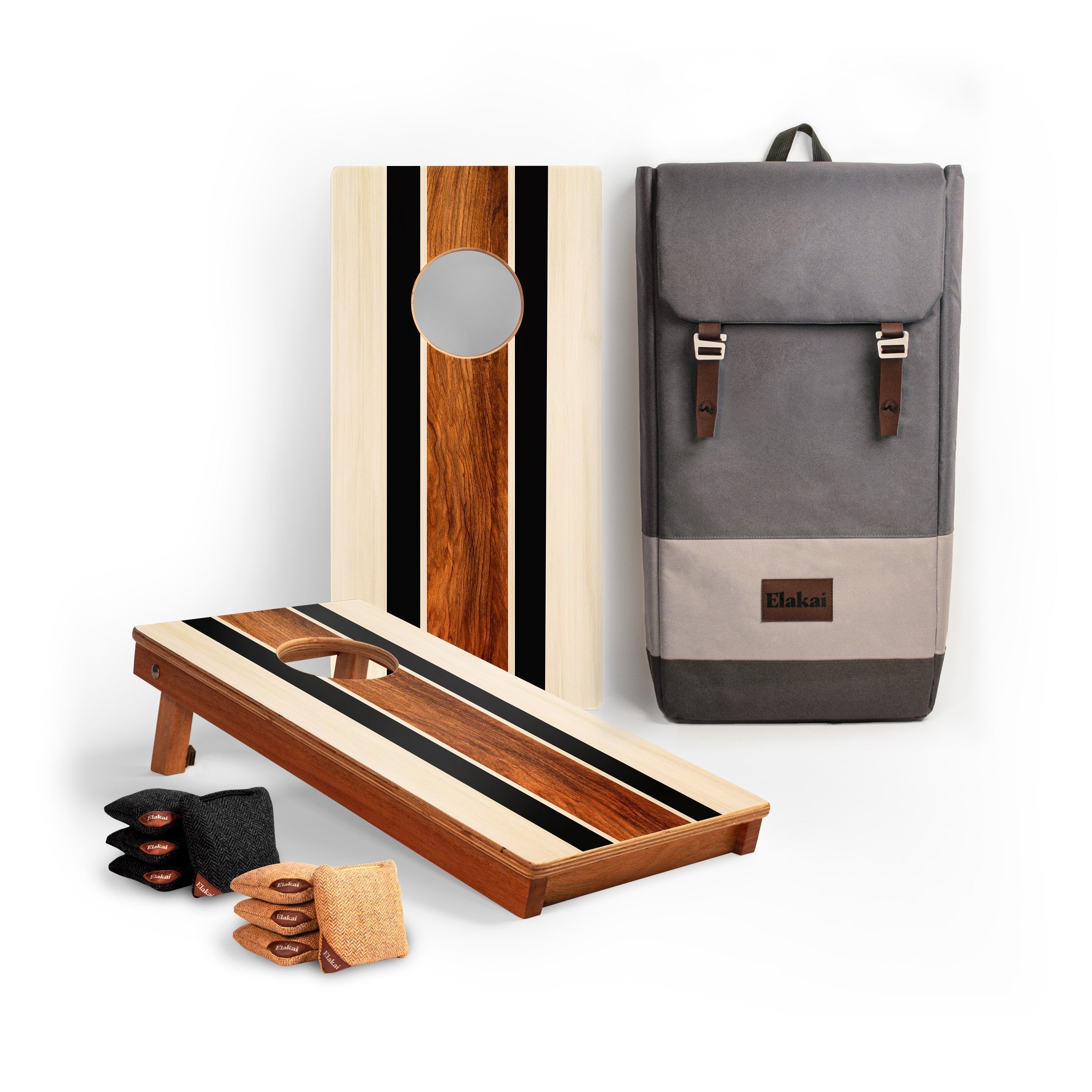 Cornhole board, bags, and a backpack on a white background