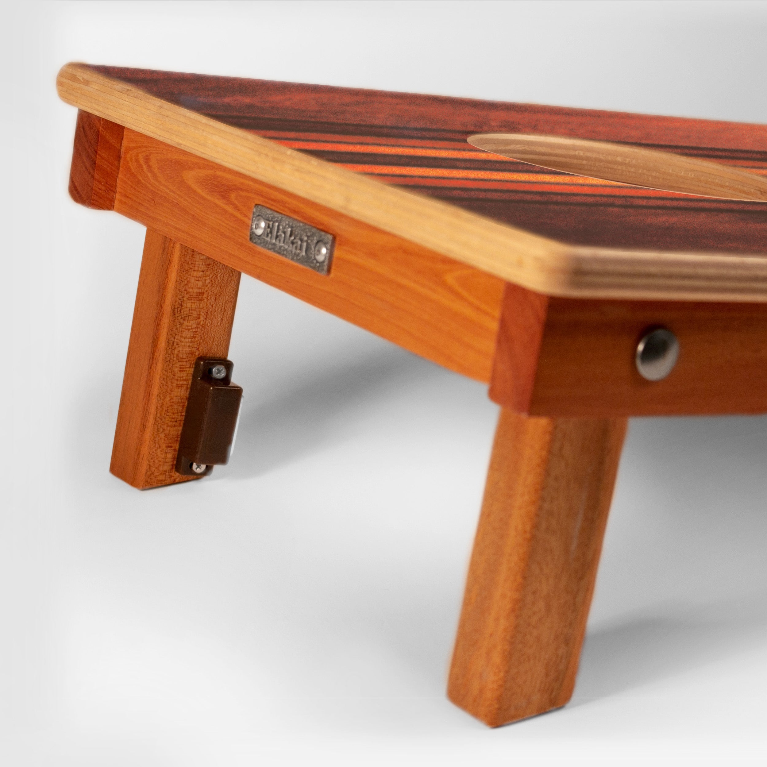 Wooden step stool with a brand label on a white background