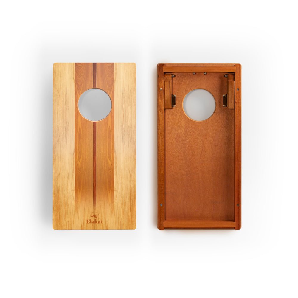Two wooden boards with circular cutouts on a white background