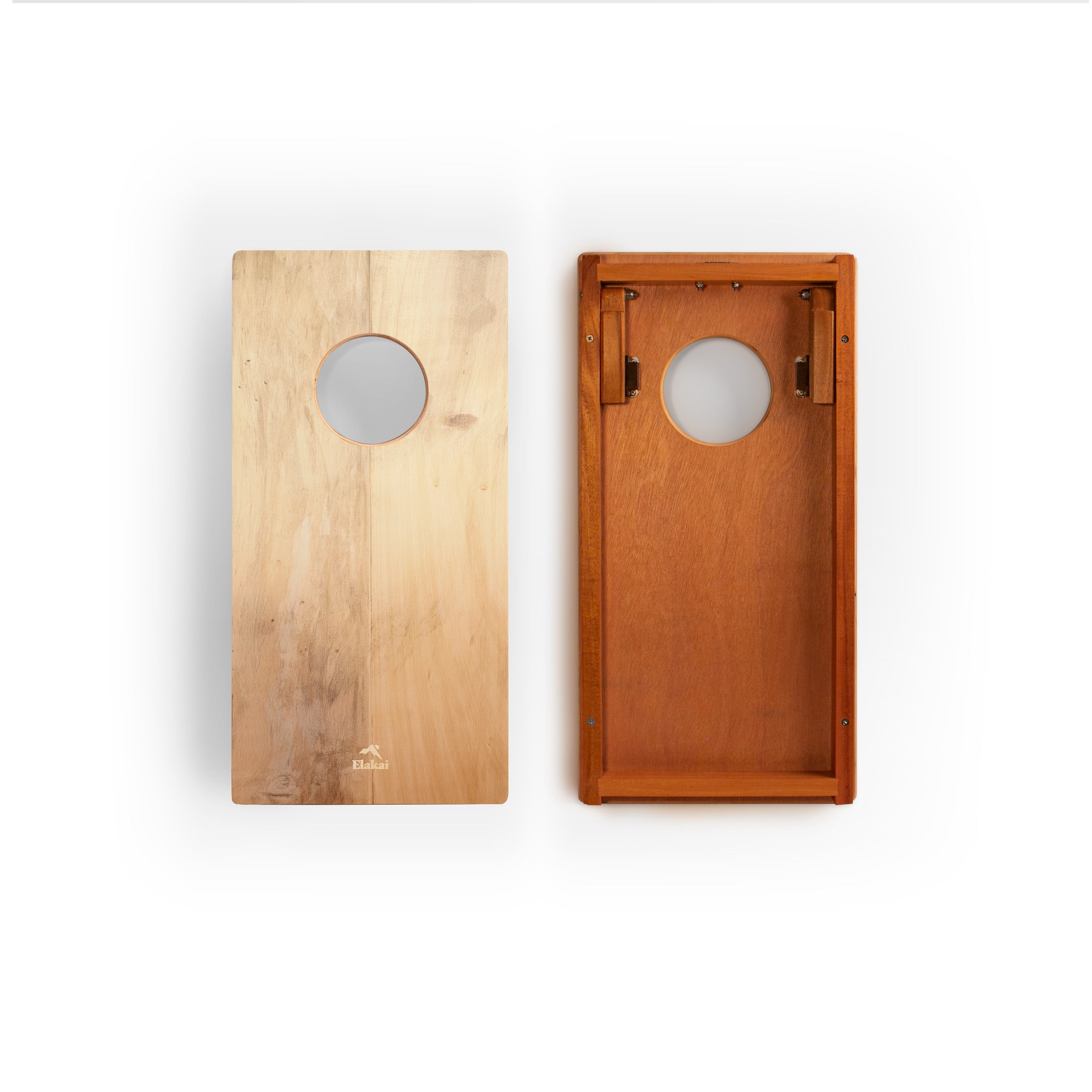 Two wooden cornhole boards shown side by side on a white background, one in light natural wood and one in medium warm brown wood, both with circular scoring holes.