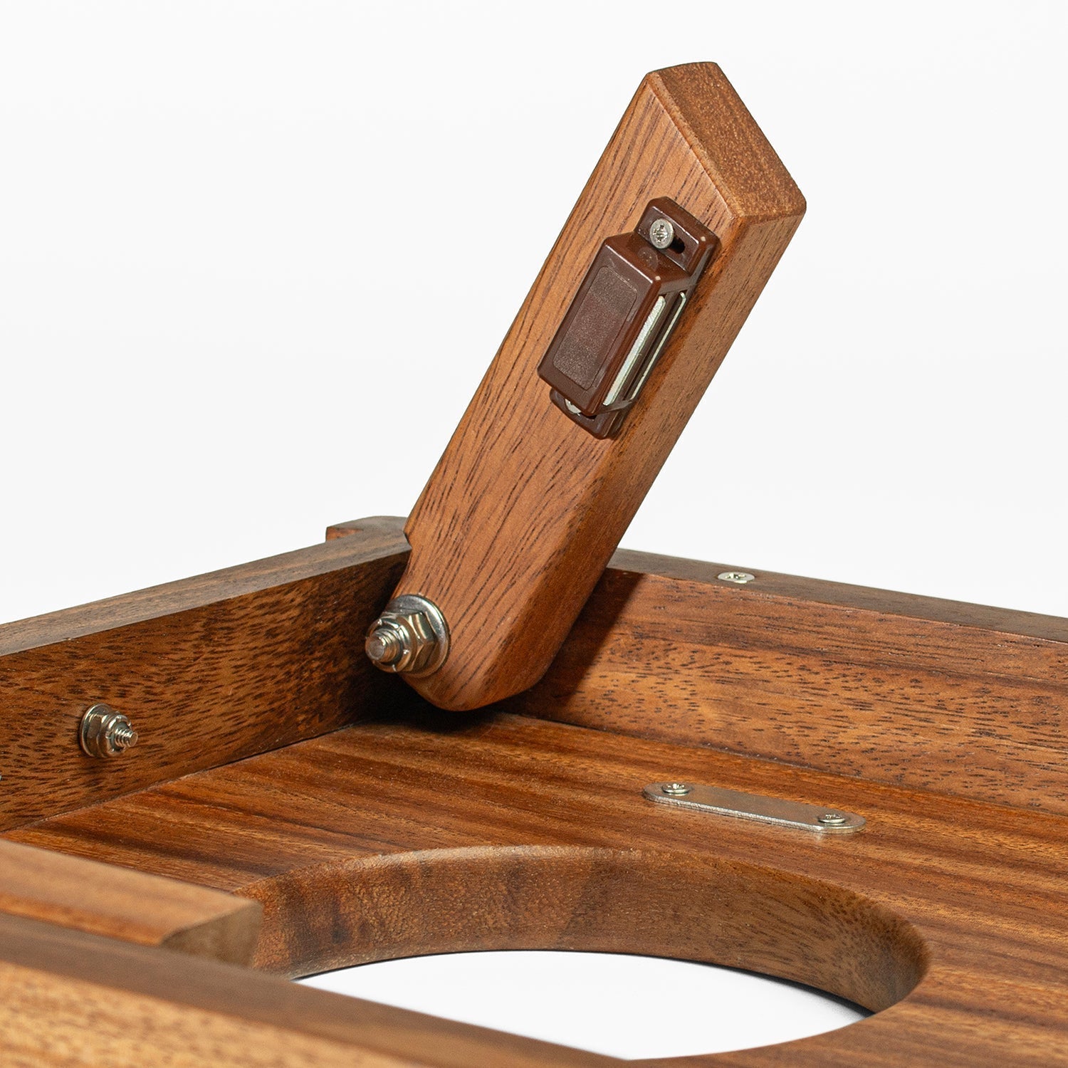 Close-up of a wooden product with a handle on a white background
