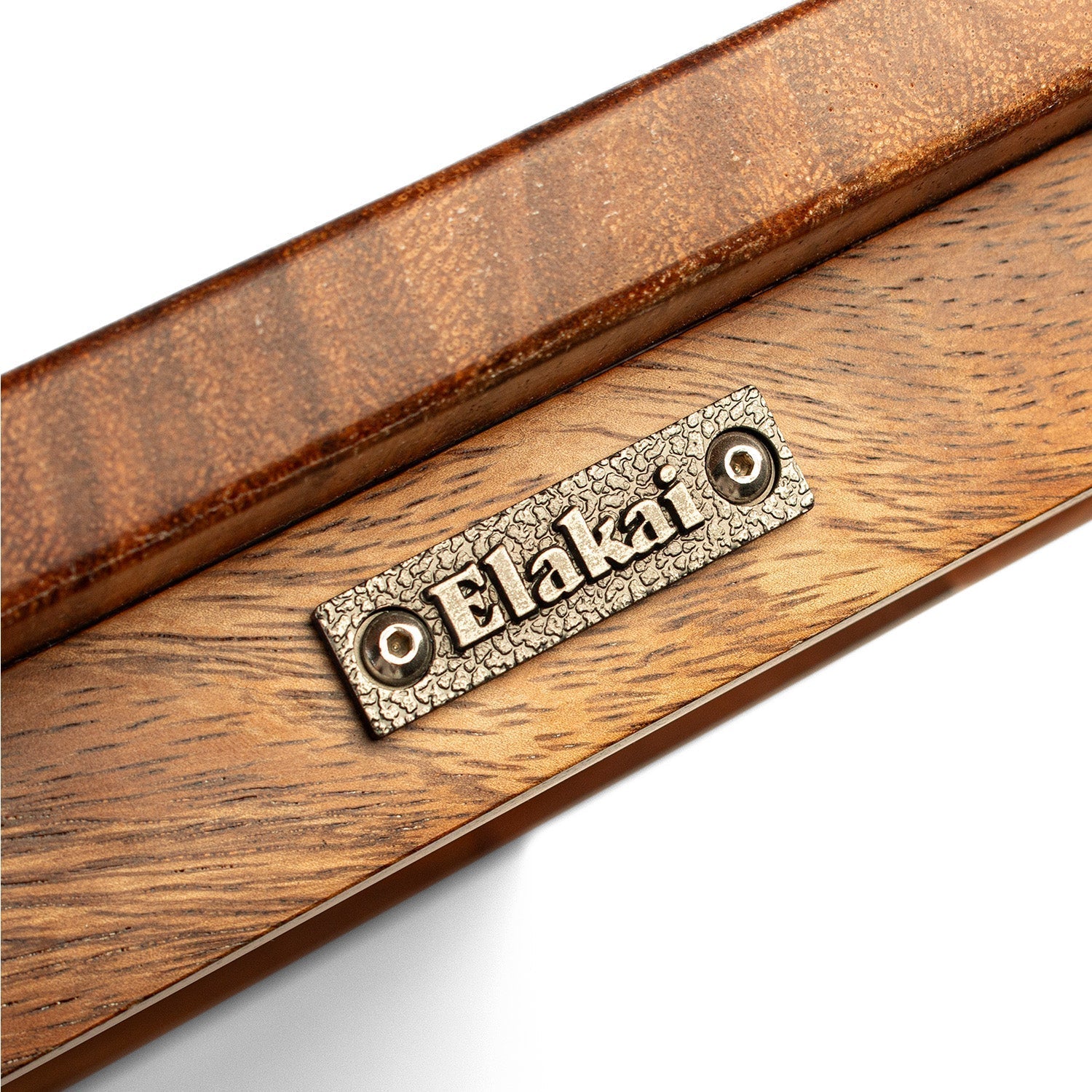 Wooden plaque with 'Elakai' branding on a white background