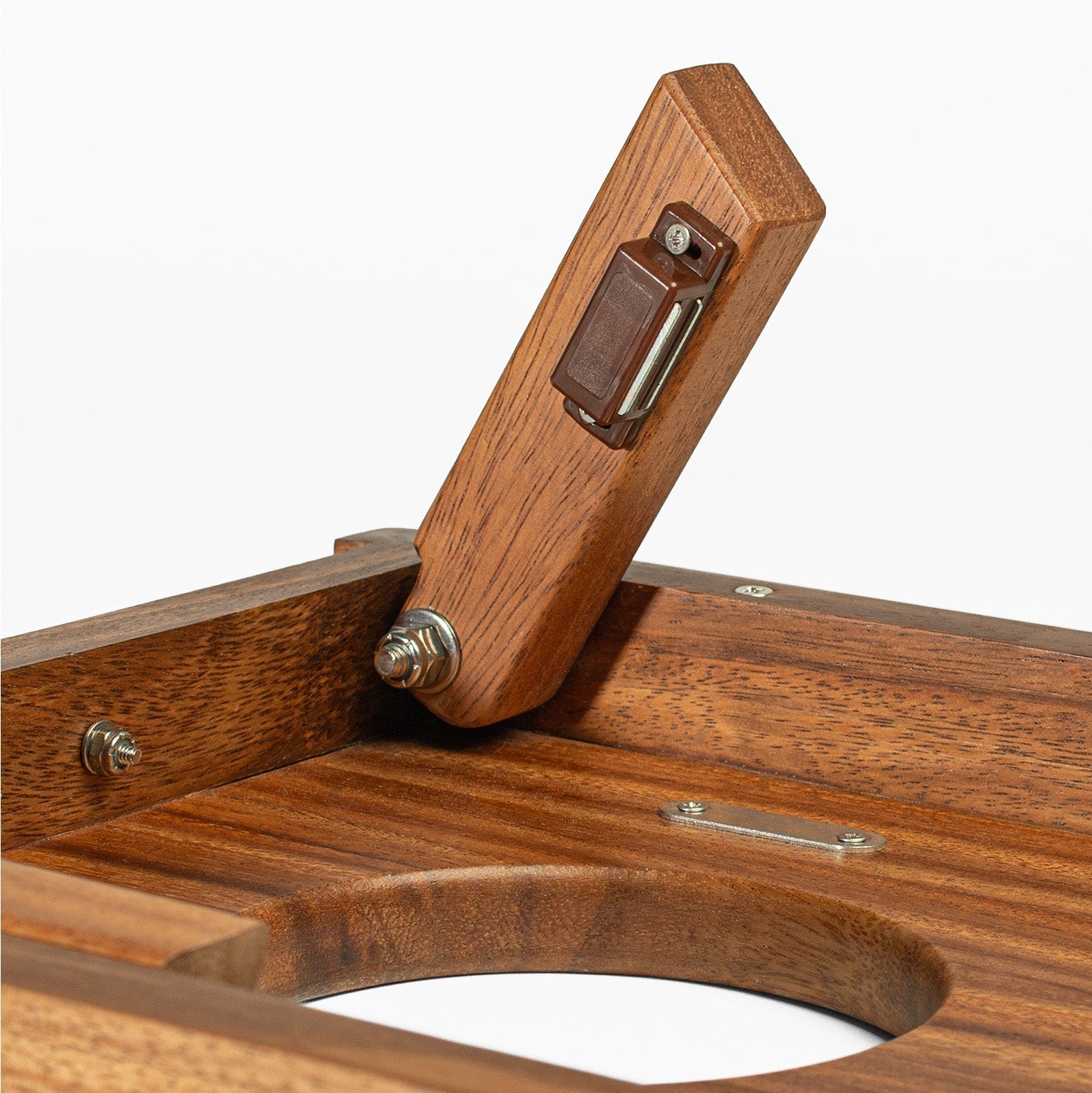 Close-up of a wooden tool with metal components on a white background