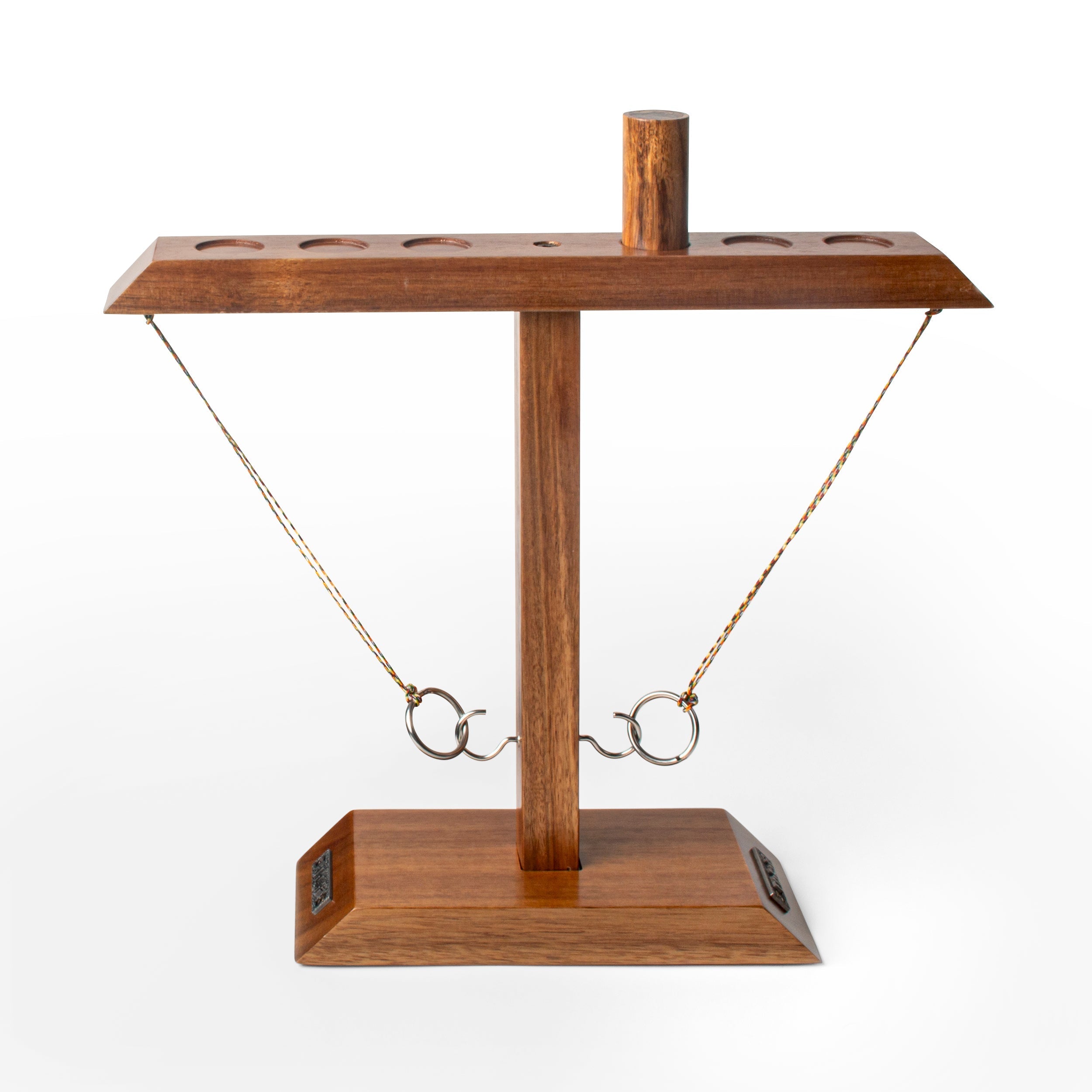 Wooden stand with a small object on a white background