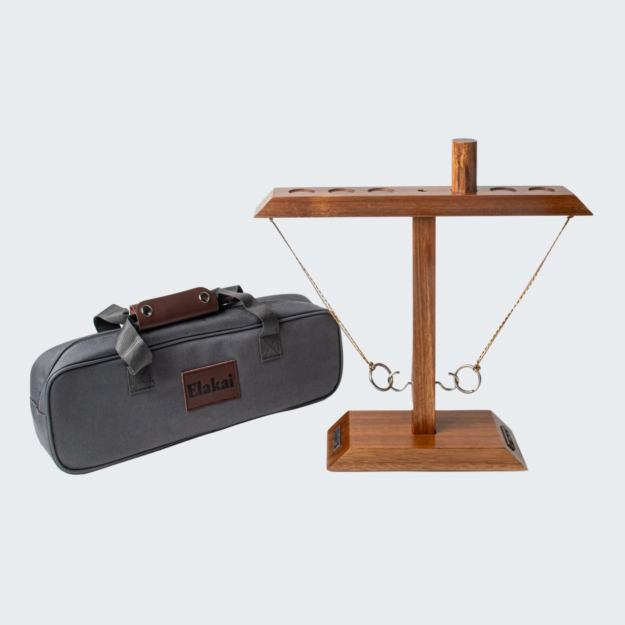 Gray carrying case with brown logo and wooden stand on a white background
