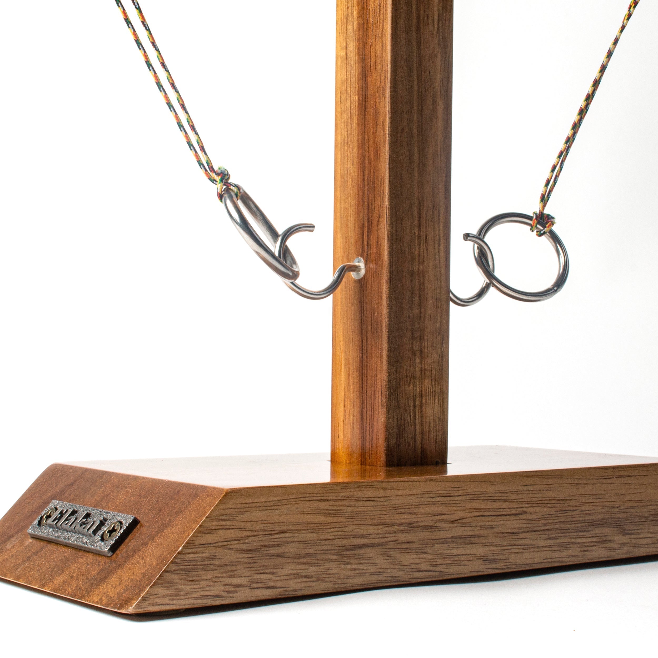 Wooden stand with metal hooks on a white background