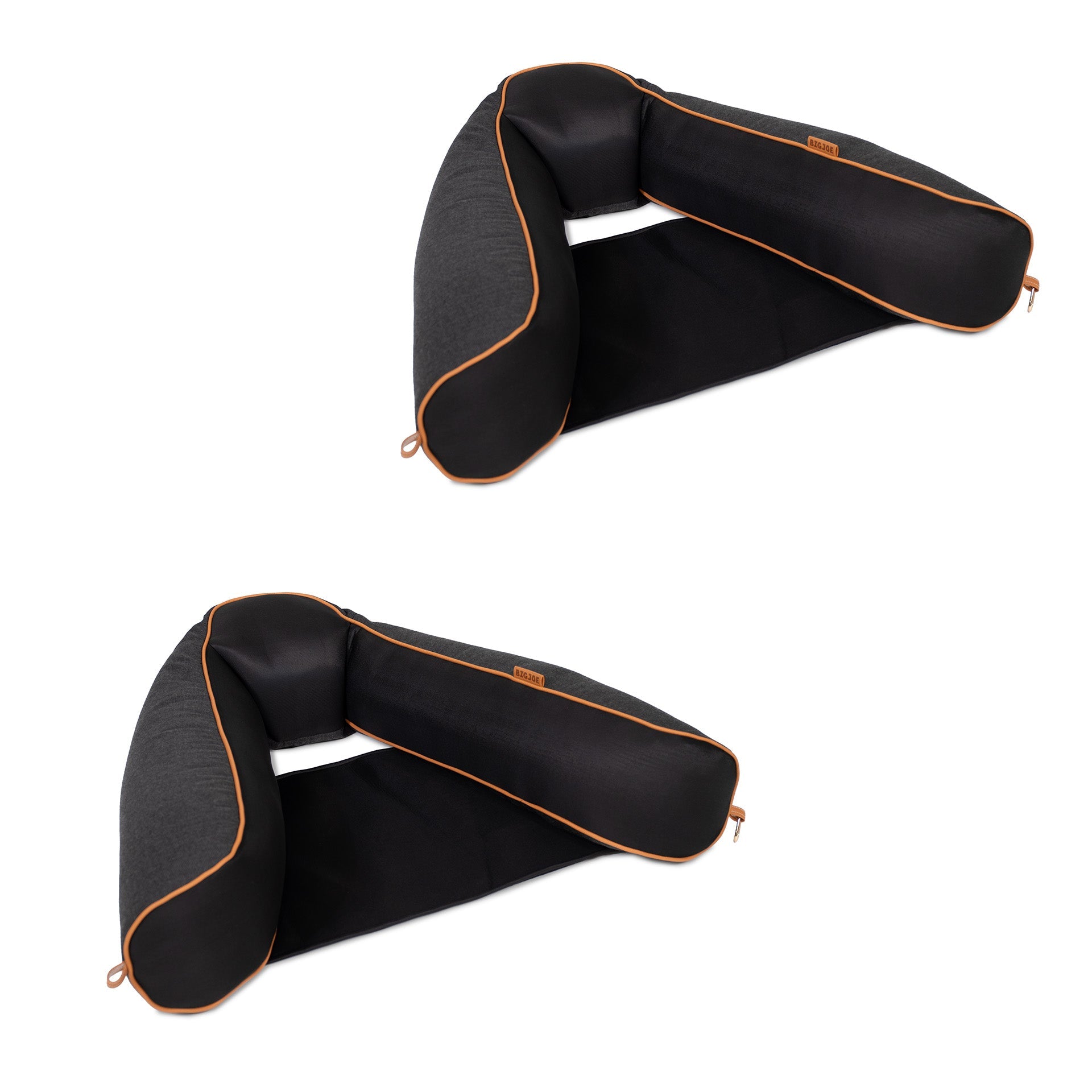 Black travel neck pillow with orange accents on a white background